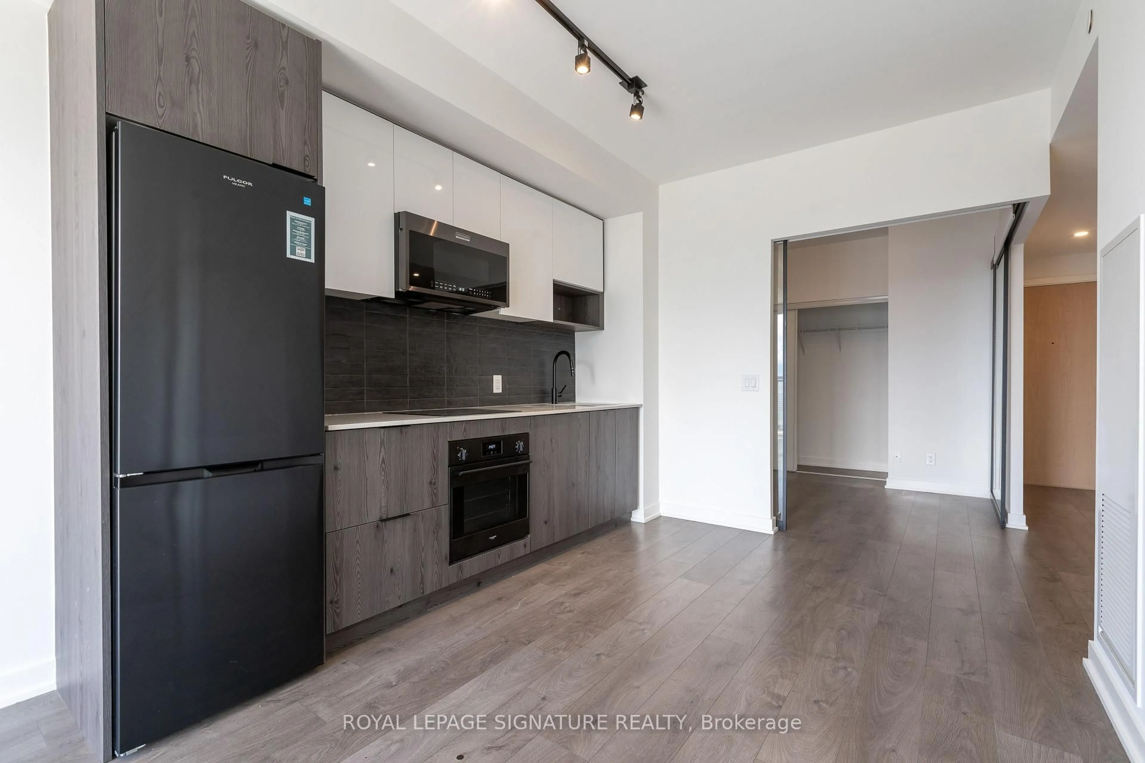 Open concept kitchen, wood/laminate floor for 5 Defries St #1804, Toronto Ontario M5A 0W7