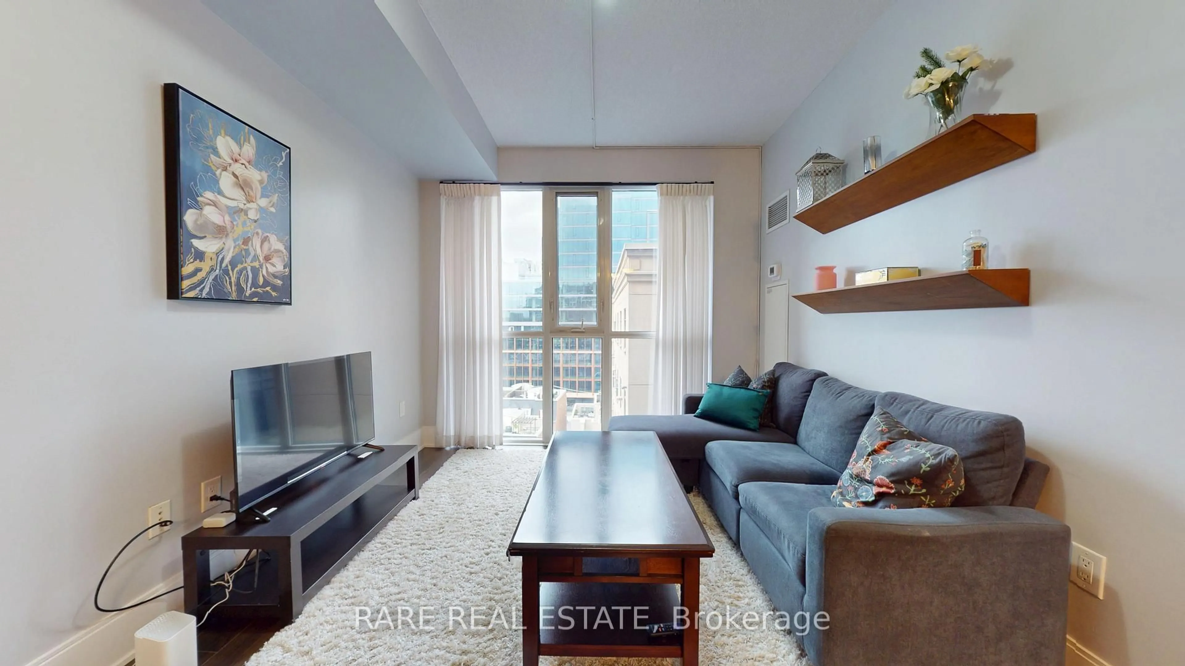 Living room with furniture, wood/laminate floor for 560 Front St #925, Toronto Ontario M5V 1C1