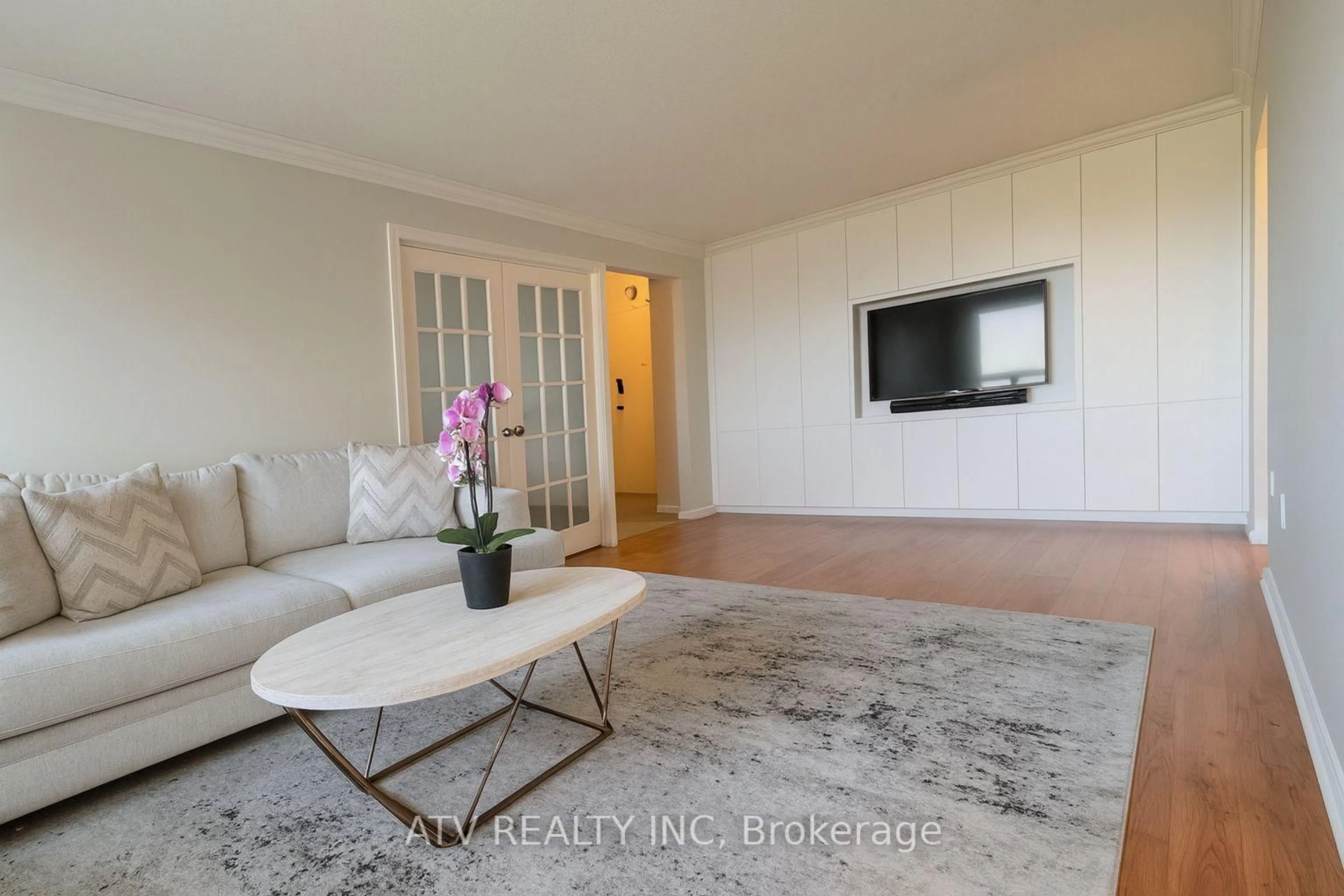 Living room with furniture, wood/laminate floor for 10 Muirhead Rd #1704, Toronto Ontario M2J 4P9
