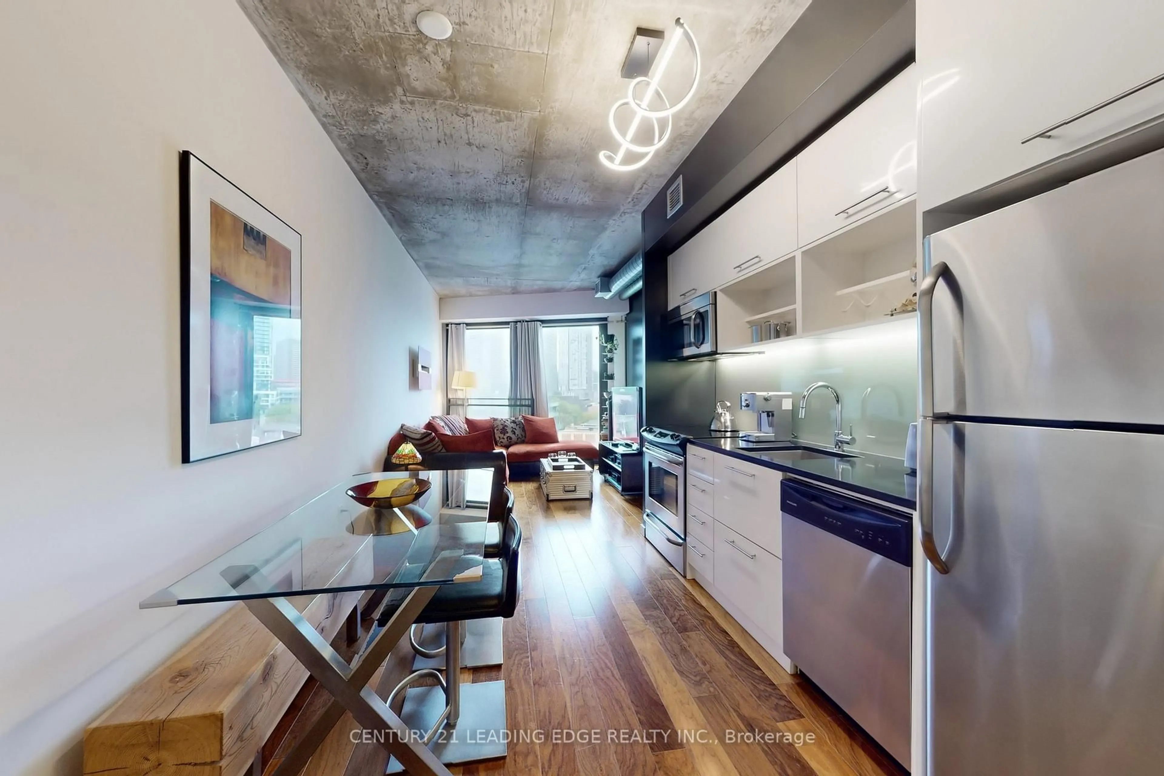 Open concept kitchen, cement floor for 51 Trolley Cres #802, Toronto Ontario M5A 0E9