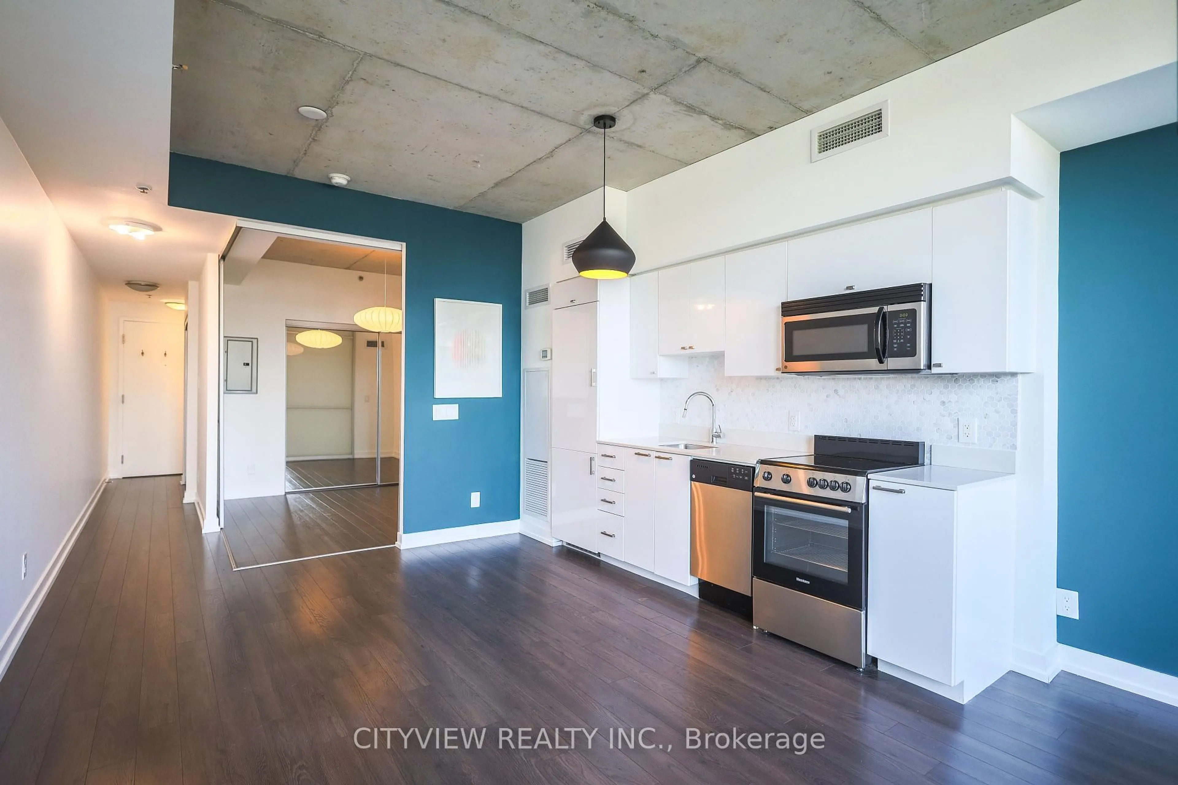 Open concept kitchen, cement floor for 707 Dovercourt Rd #416, Toronto Ontario M6H 0B5