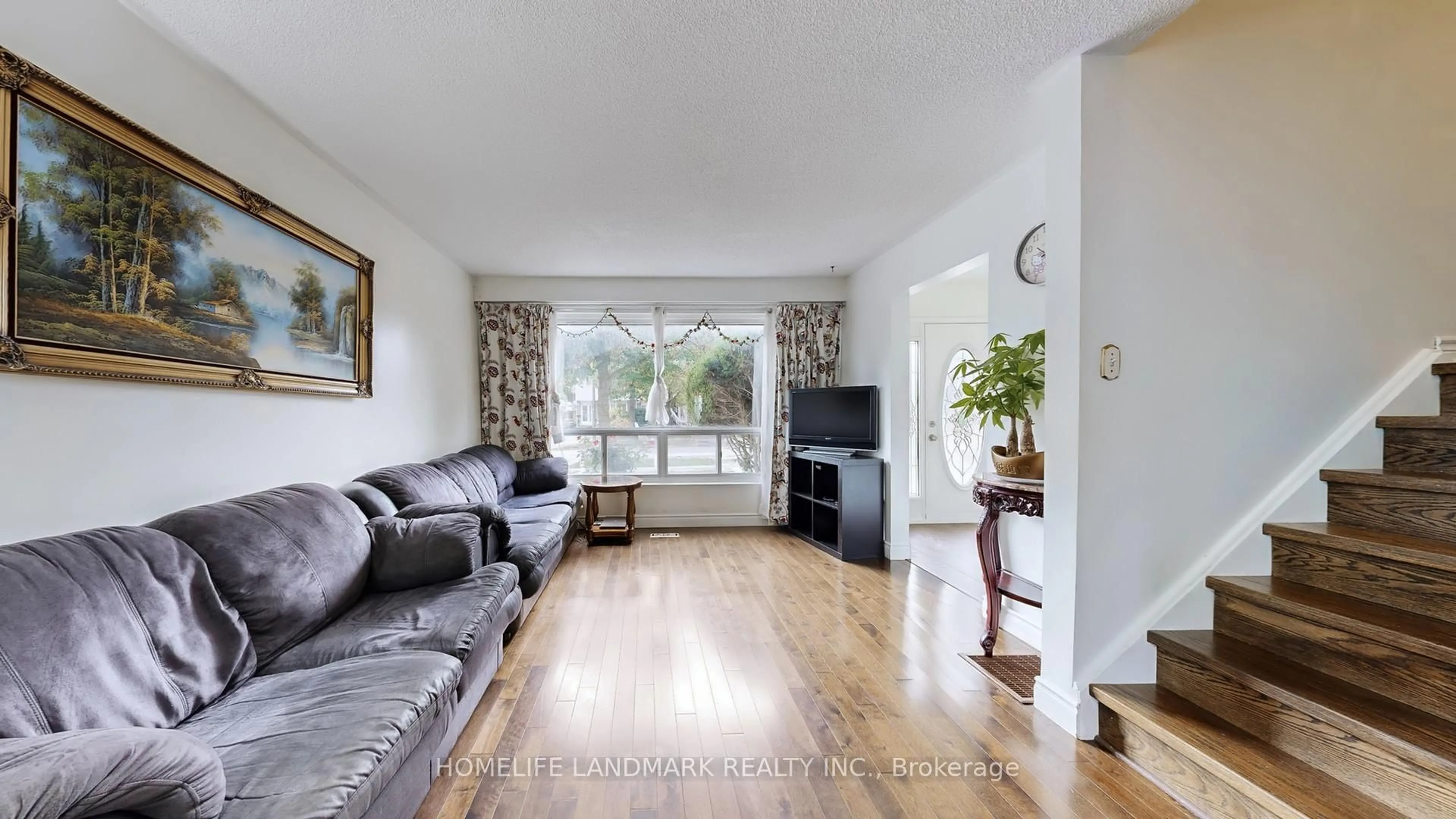 Living room with furniture, wood/laminate floor for 306 Hollyberry Tr, Toronto Ontario M2H 2P4