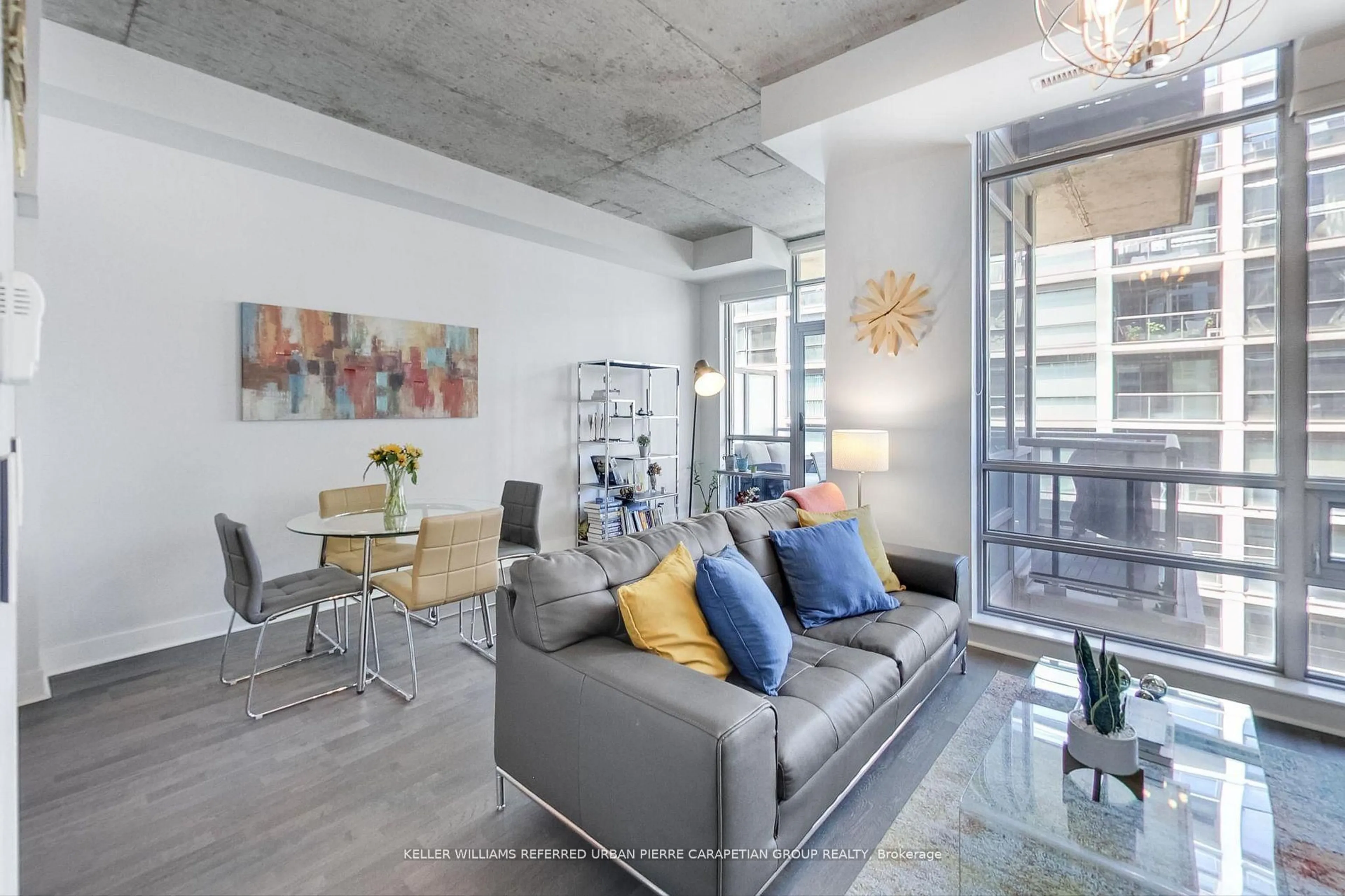 Living room with furniture, cement floor for 399 Adelaide St #520, Toronto Ontario M5V 1S4