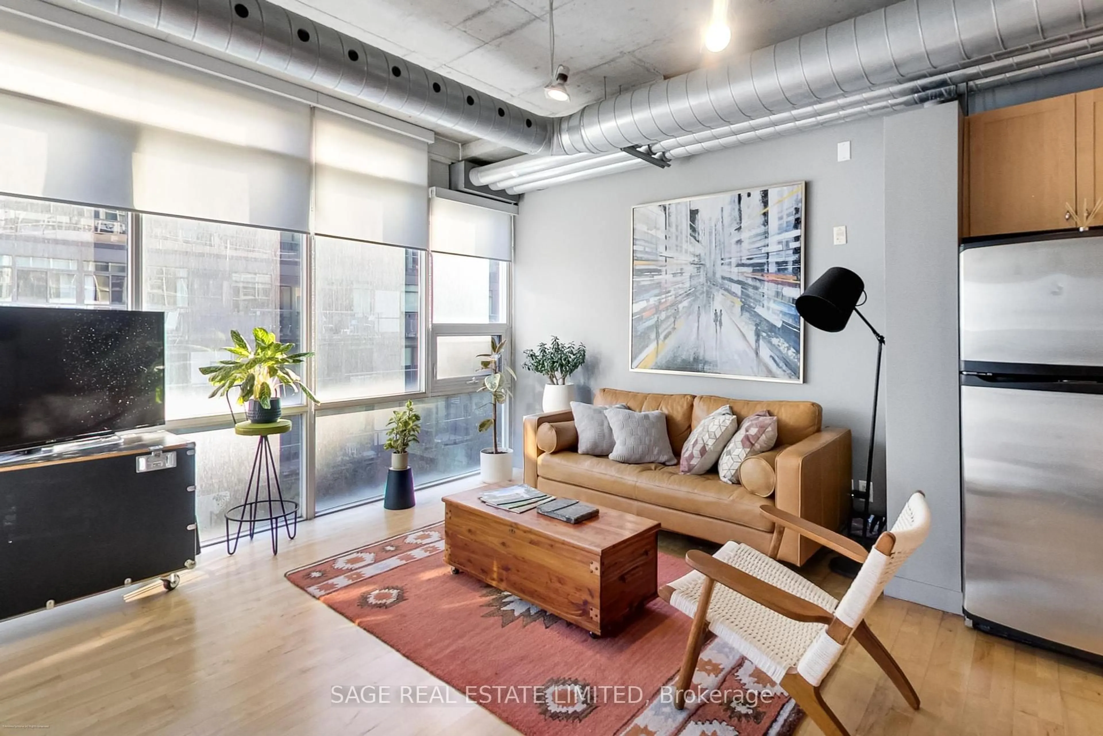 Living room with furniture, cement floor for 32 Stewart St #504, Toronto Ontario M5V 3T2