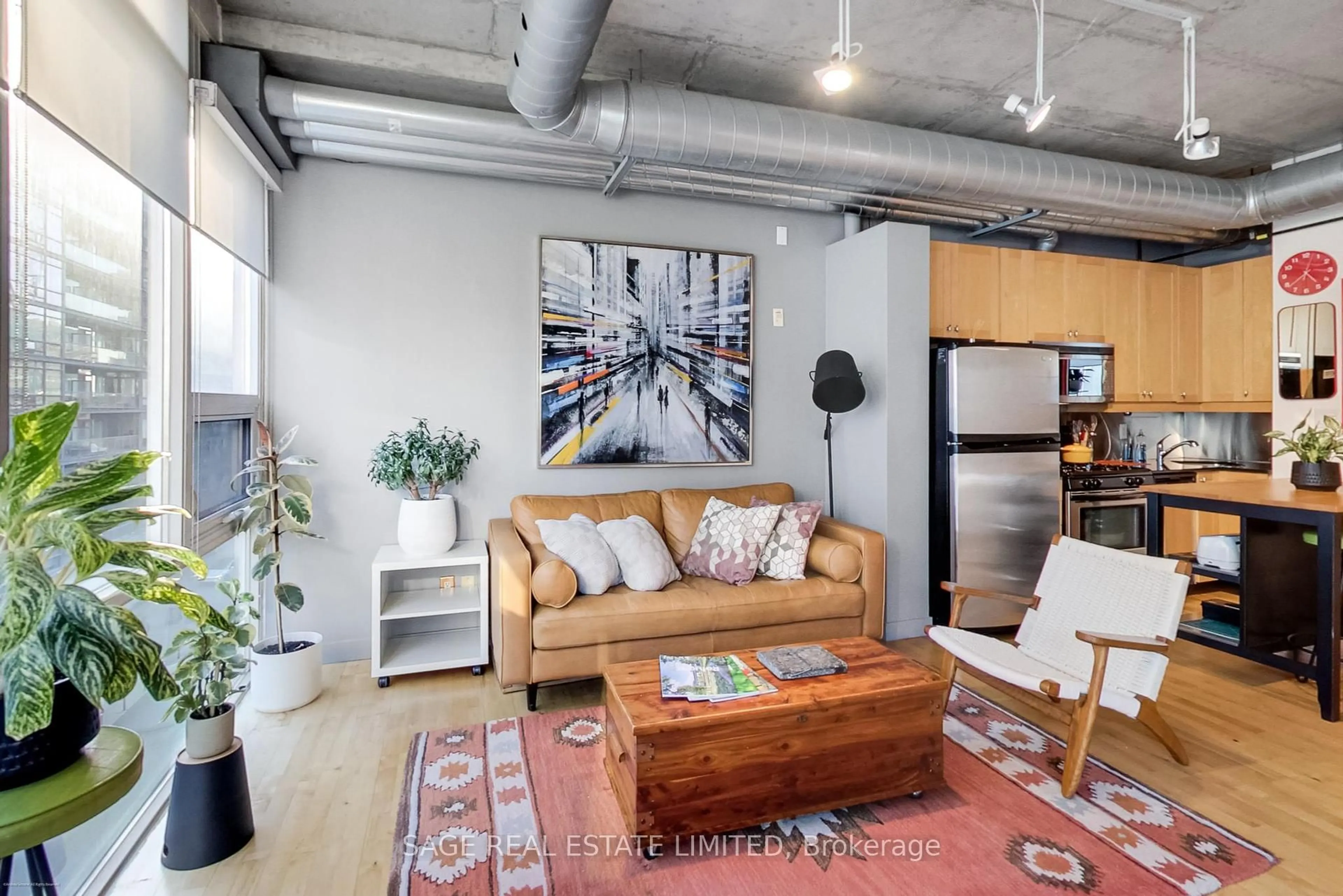 Living room with furniture, cement floor for 32 Stewart St #504, Toronto Ontario M5V 3T2