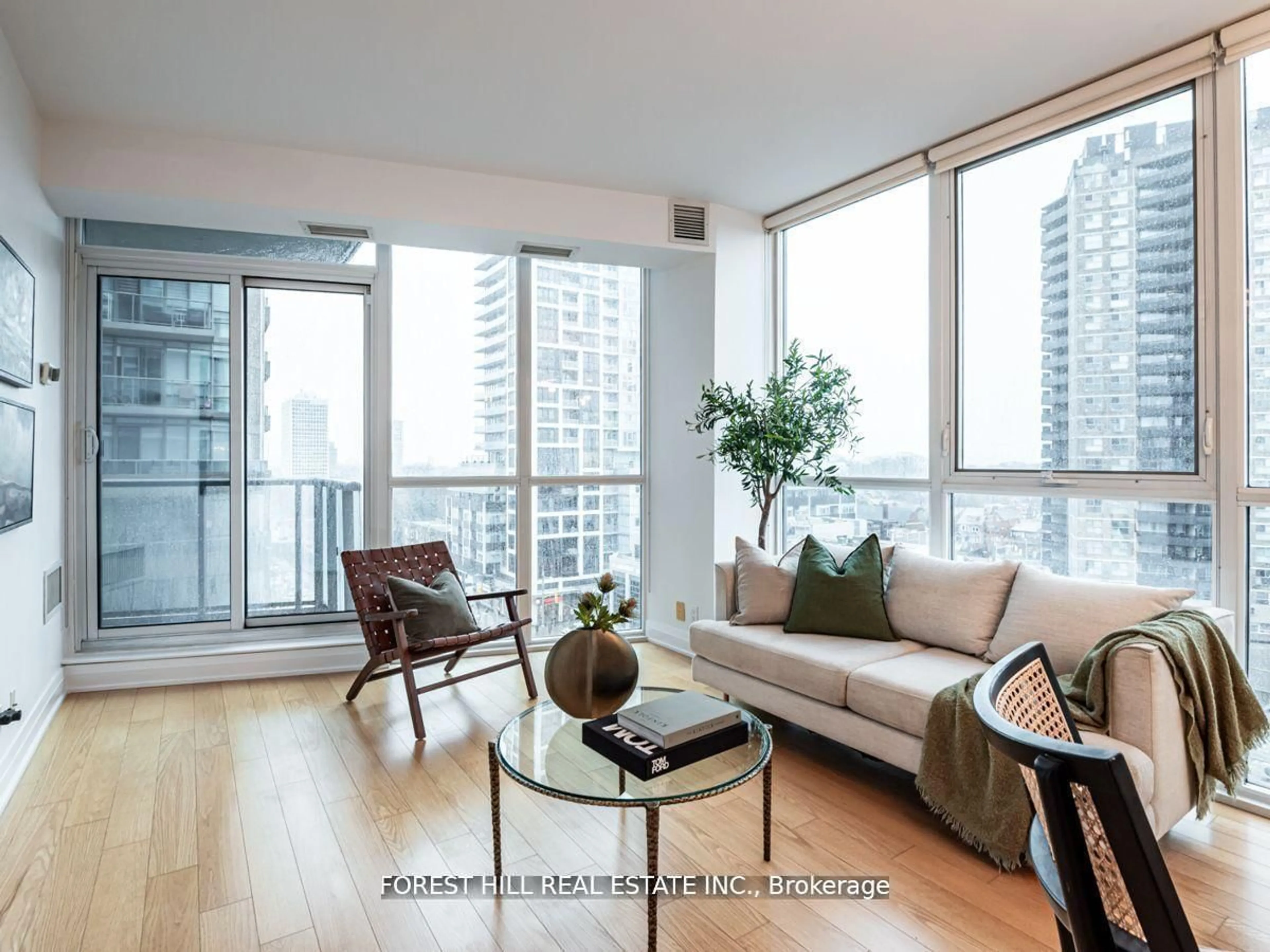 Living room with furniture, wood/laminate floor for 530 St Clair Ave #707, Toronto Ontario M6C 0A2