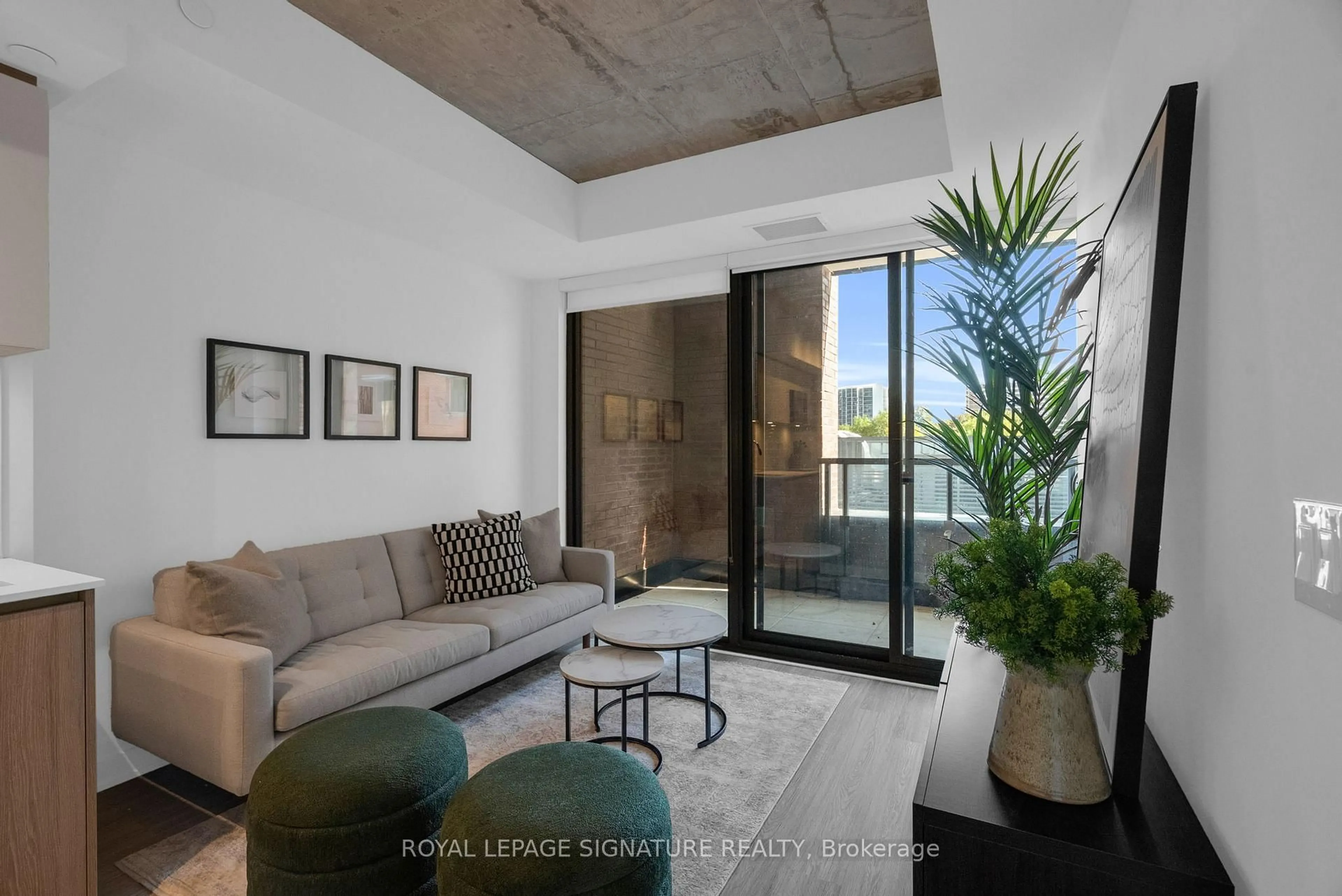 Living room with furniture, cement floor for 47 Mutual St #307, Toronto Ontario M5B 0C6