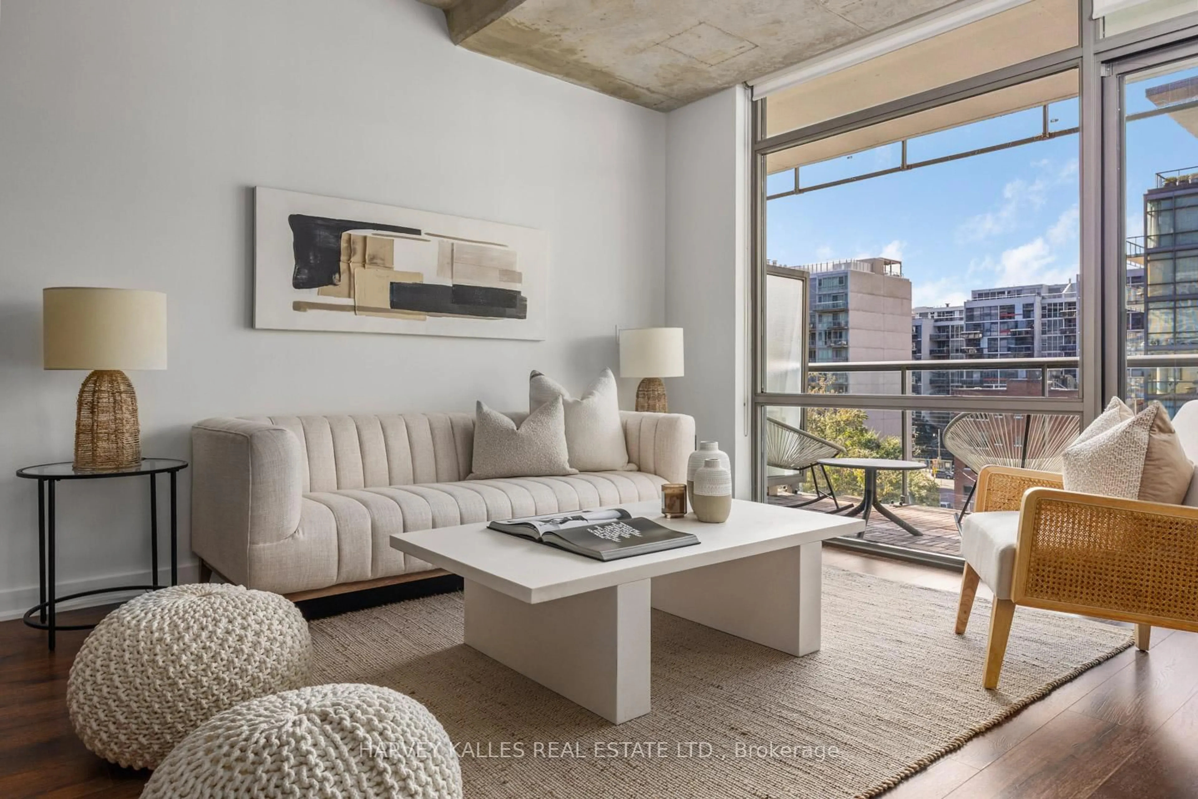 Living room with furniture, cement floor for 55 Stewart St #723, Toronto Ontario M5V 2V1