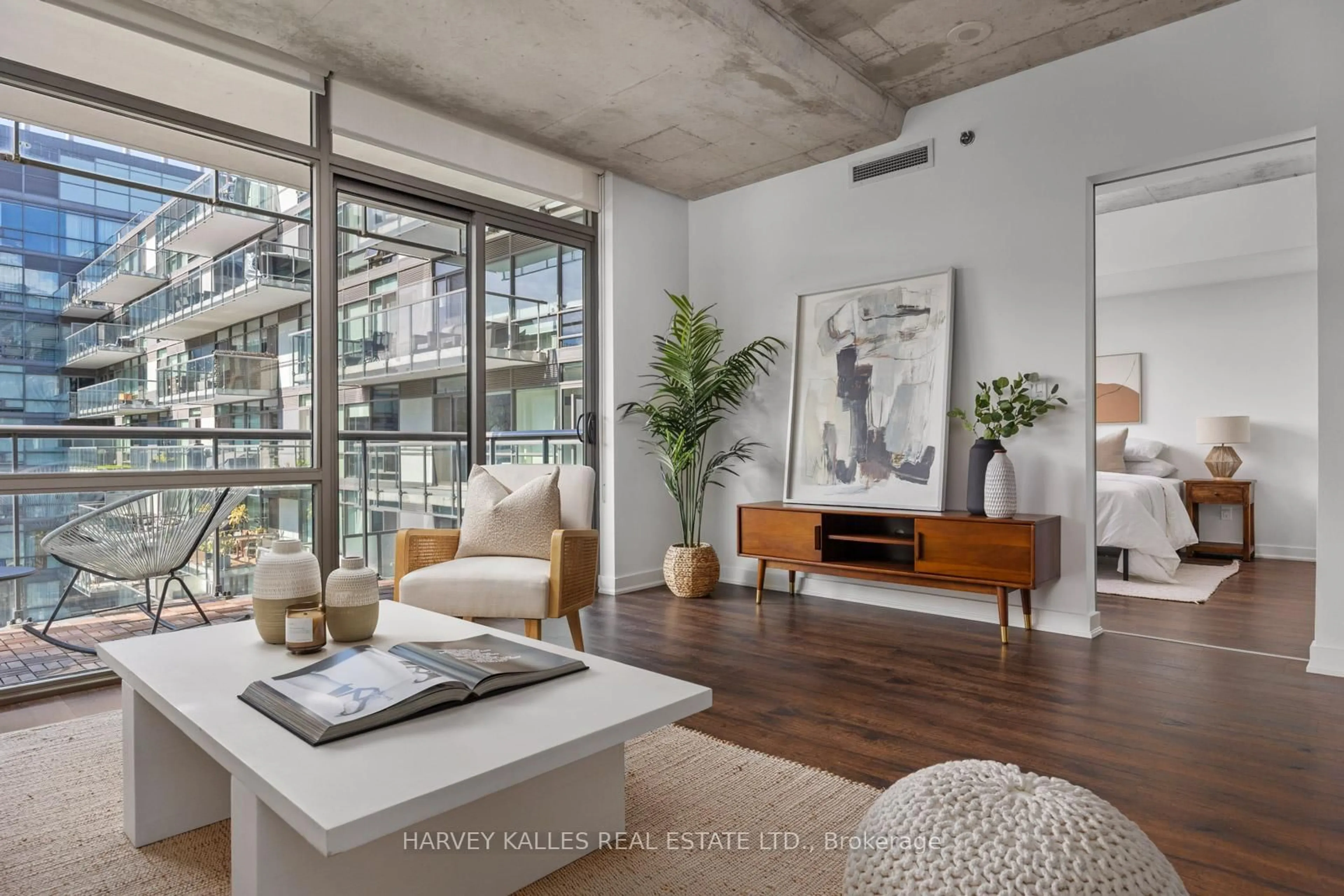 Living room with furniture, cement floor for 55 Stewart St #723, Toronto Ontario M5V 2V1