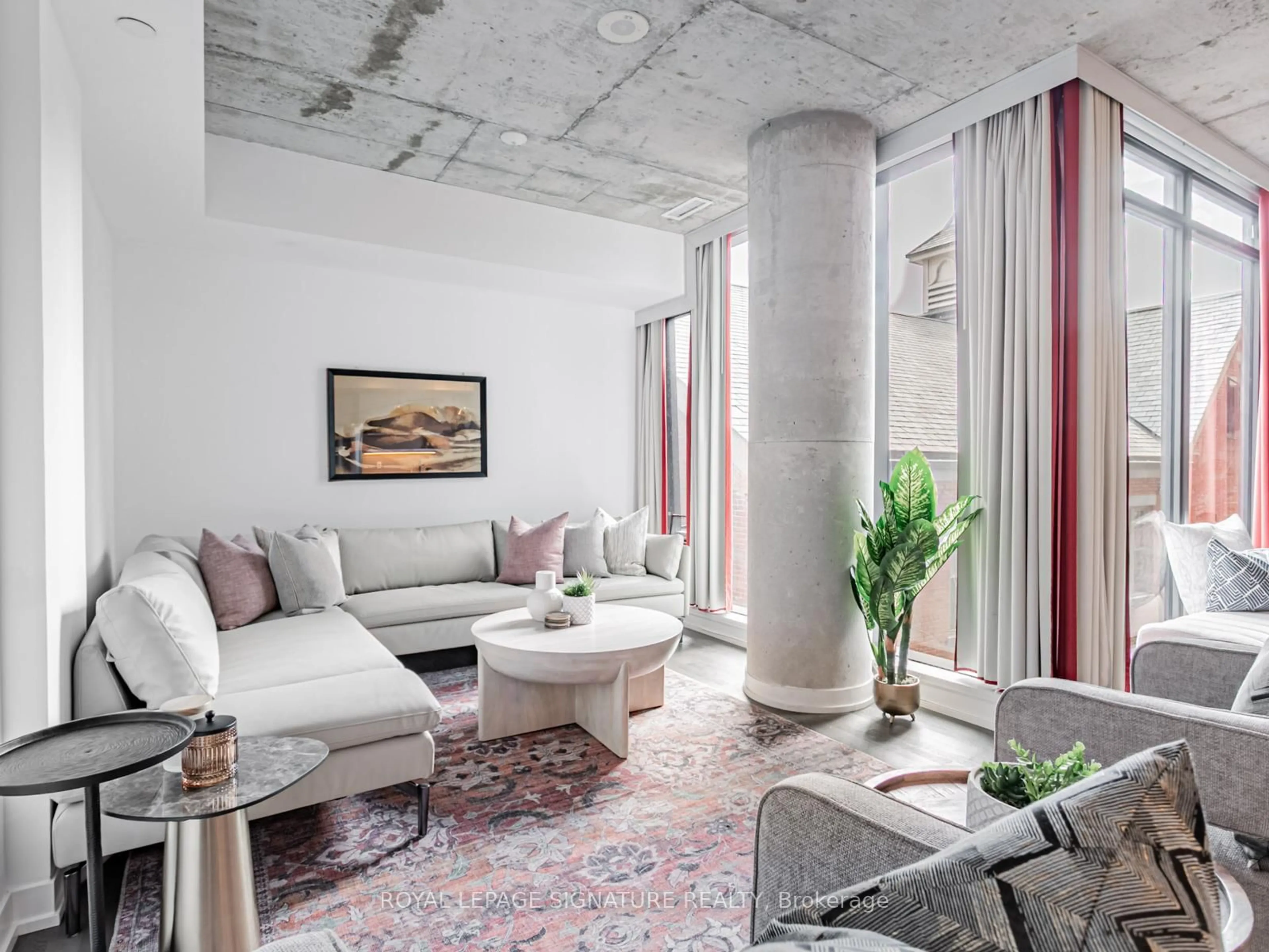 Living room with furniture, cement floor for 560 King St #418, Toronto Ontario M5V 0L5