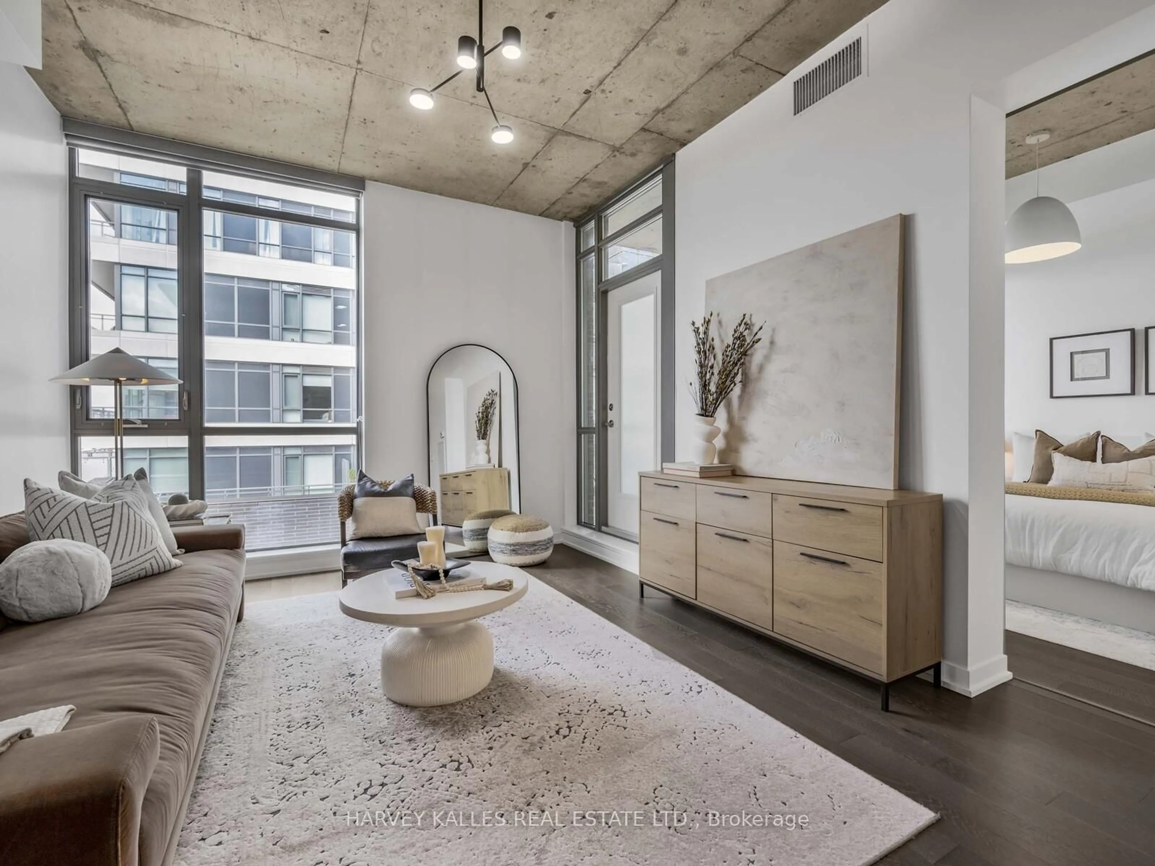 Living room with furniture, cement floor for 8 Gladstone Ave #615, Toronto Ontario M6J 3K6