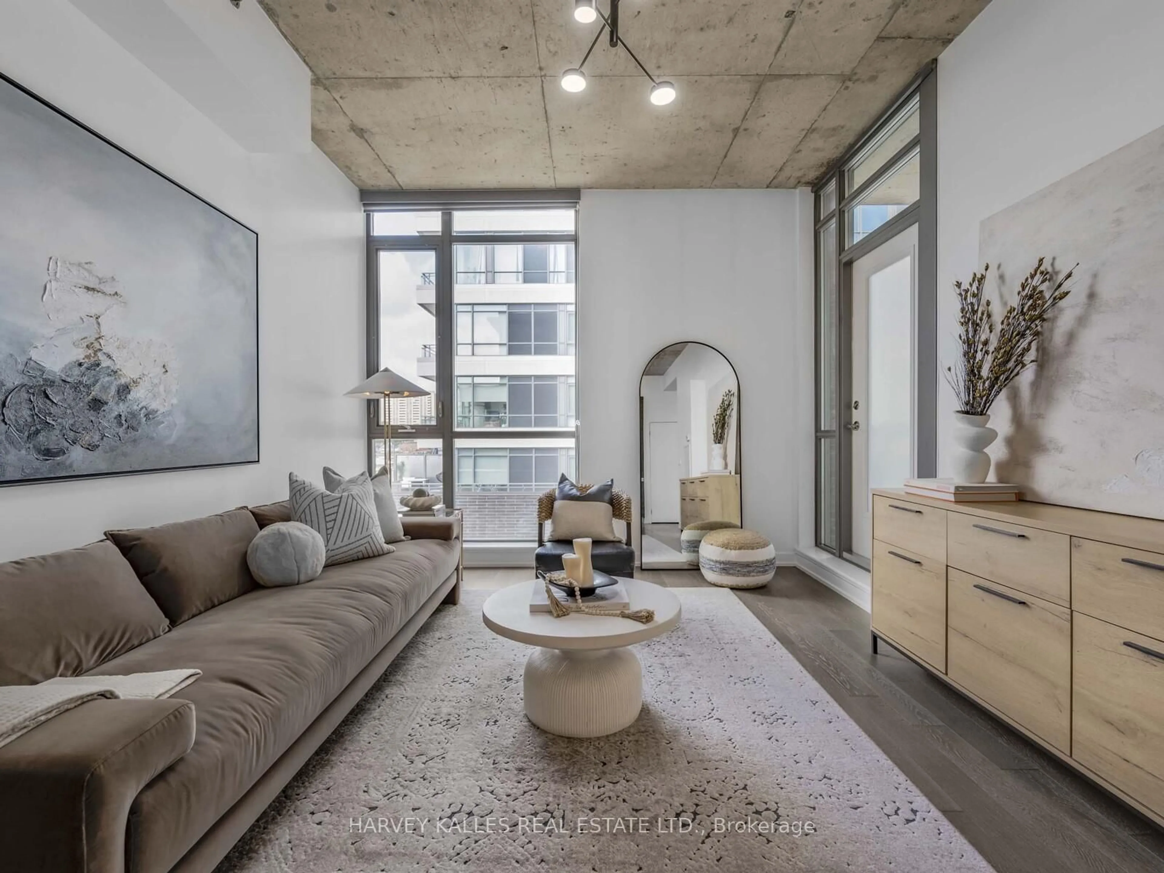 Living room with furniture, cement floor for 8 Gladstone Ave #615, Toronto Ontario M6J 3K6