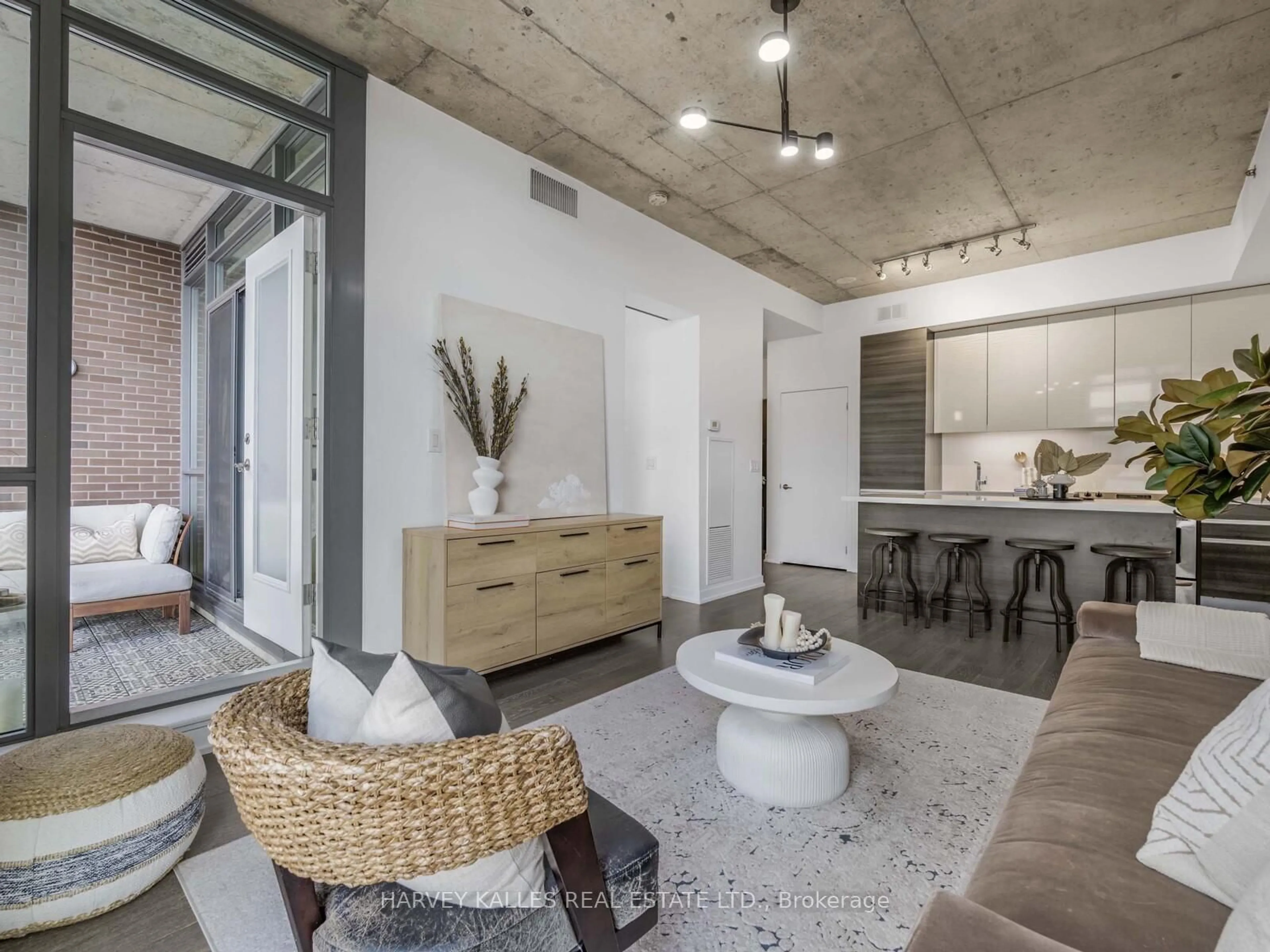 Living room with furniture, cement floor for 8 Gladstone Ave #615, Toronto Ontario M6J 3K6