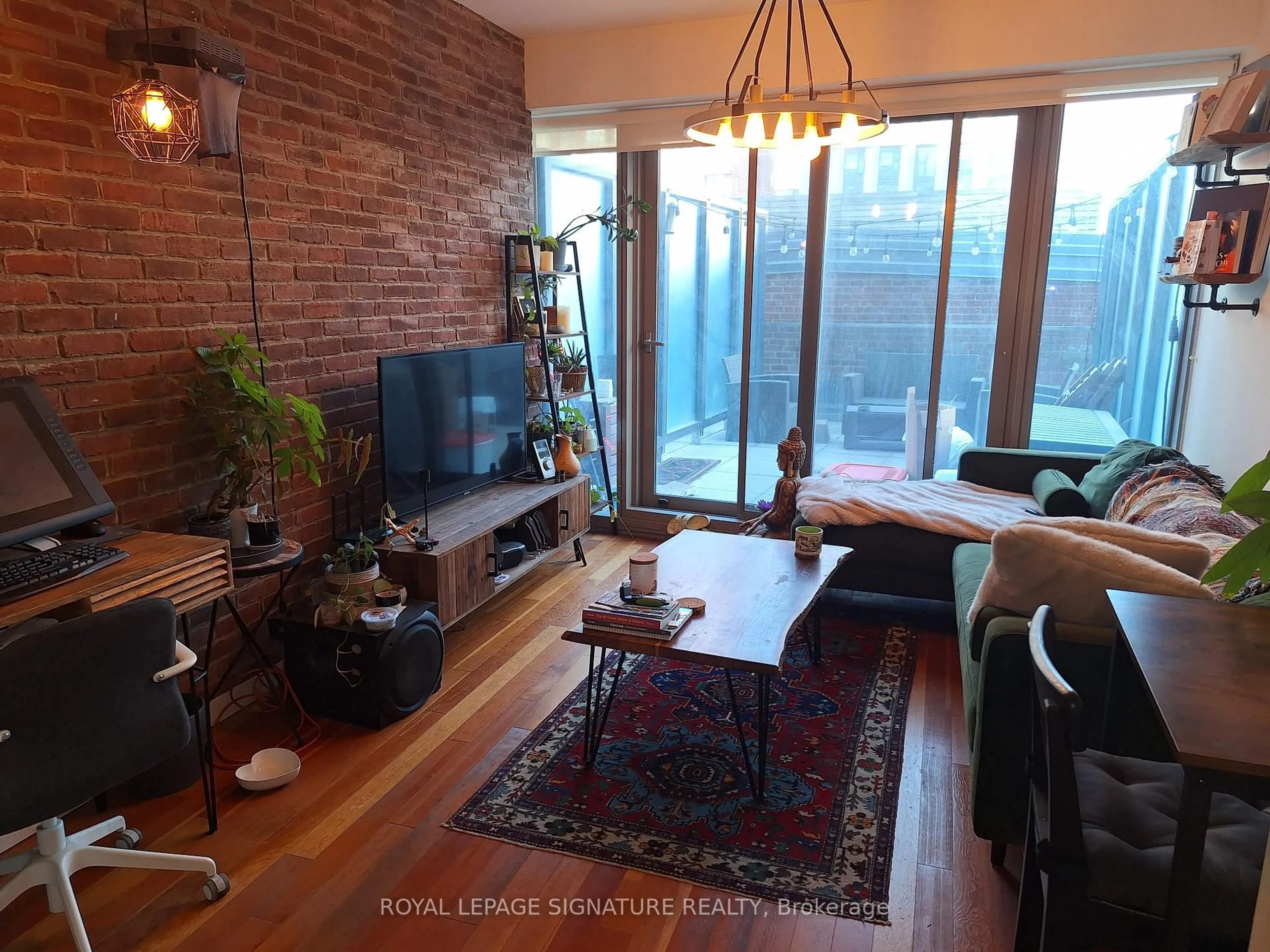 Living room with furniture, wood/laminate floor for 390 Cherry St #204, Toronto Ontario M5A 0E2