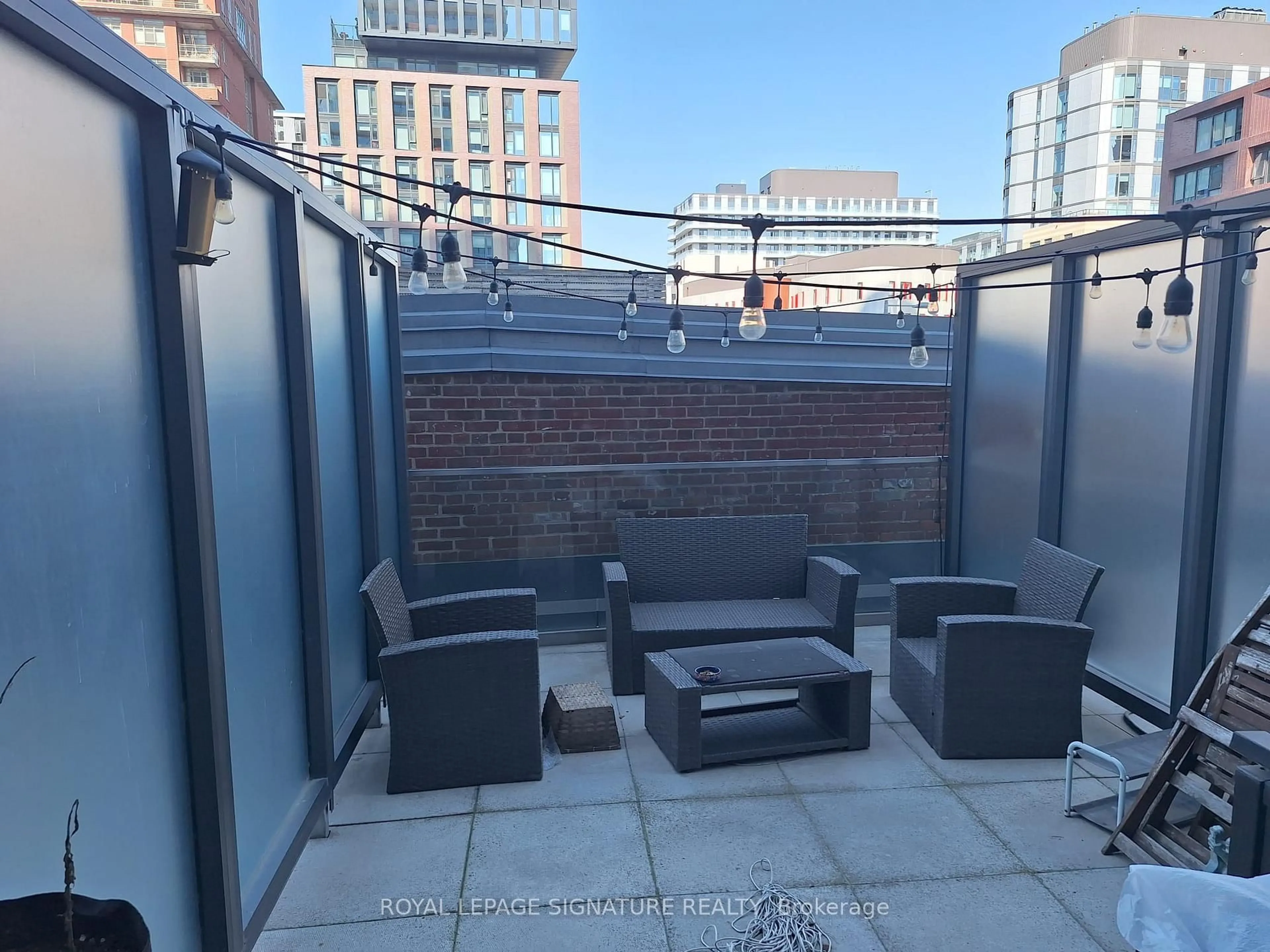Patio, city buildings view from balcony for 390 Cherry St #204, Toronto Ontario M5A 0E2
