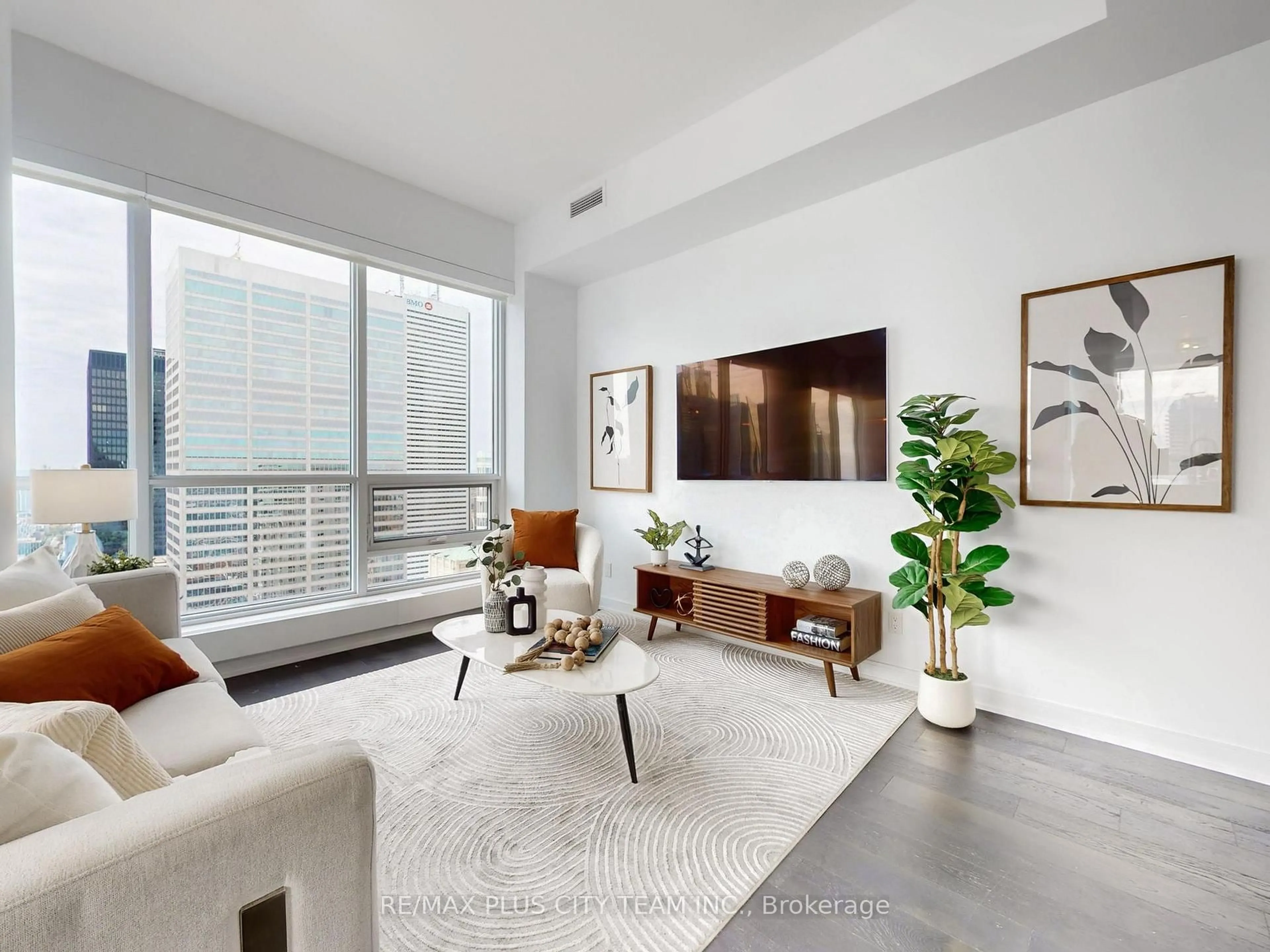 Living room with furniture, unknown for 88 Scott St #5504, Toronto Ontario M5E 0A9