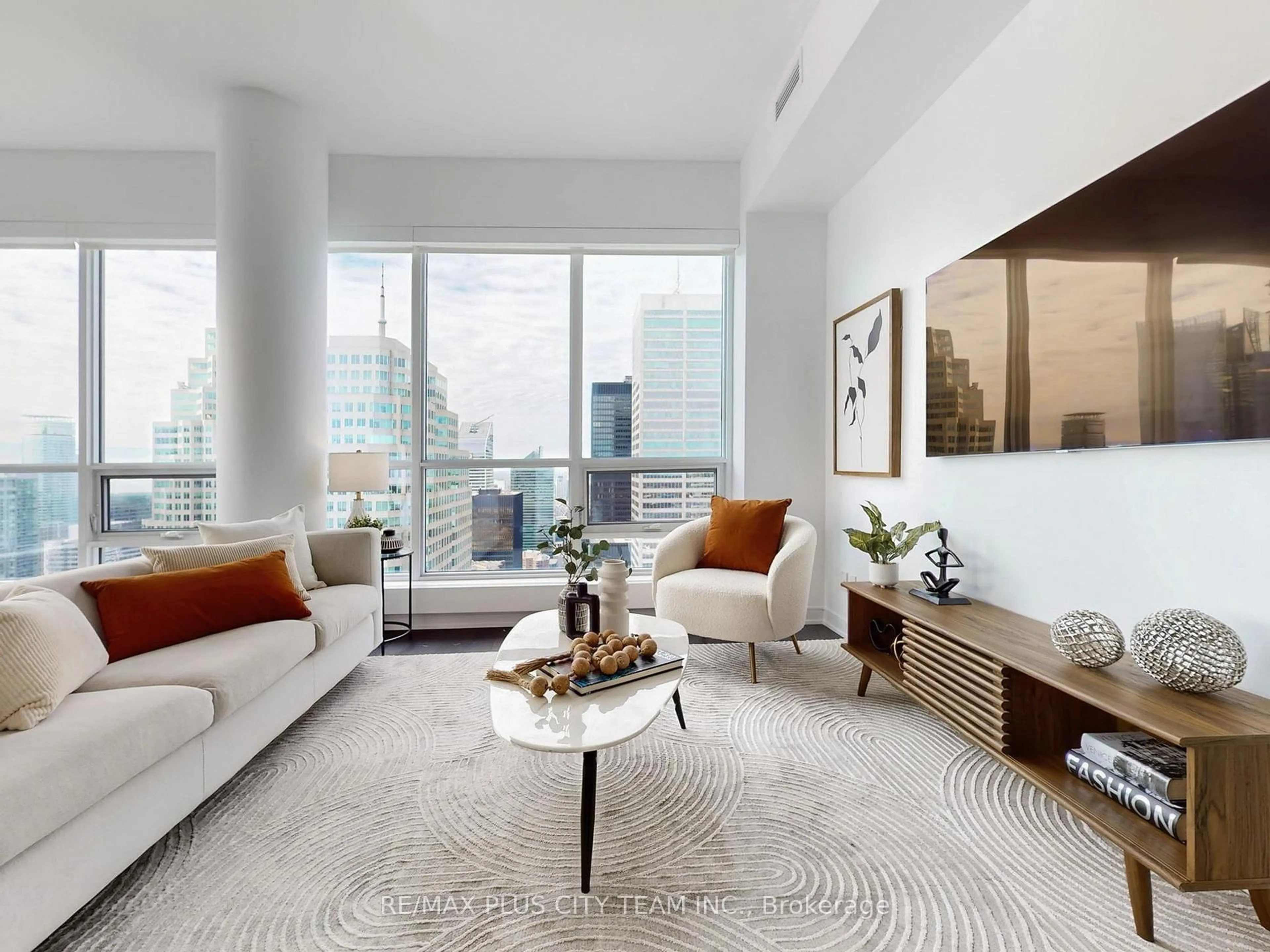 Living room with furniture, unknown for 88 Scott St #5504, Toronto Ontario M5E 0A9