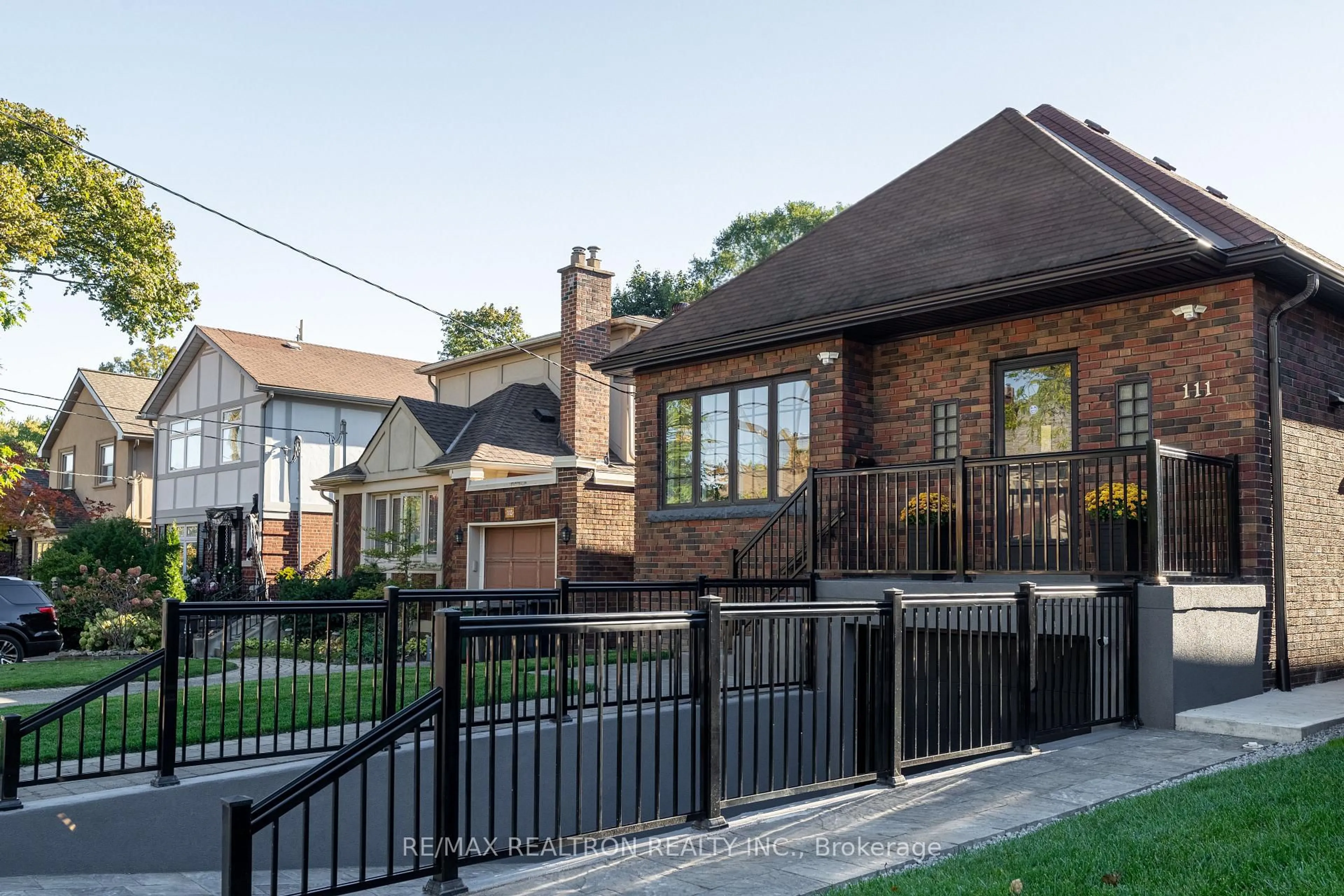 Home with brick exterior material, street for 111 Sutherland Dr, Toronto Ontario M4G 1H8