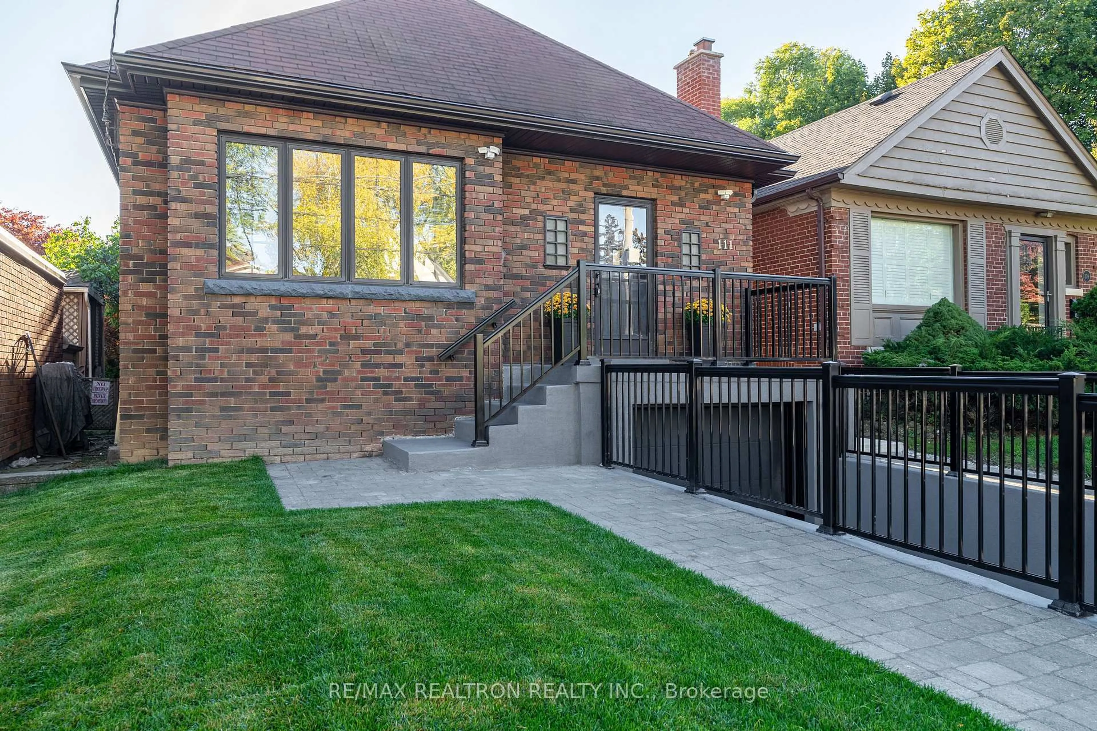 Home with brick exterior material, street for 111 Sutherland Dr, Toronto Ontario M4G 1H8