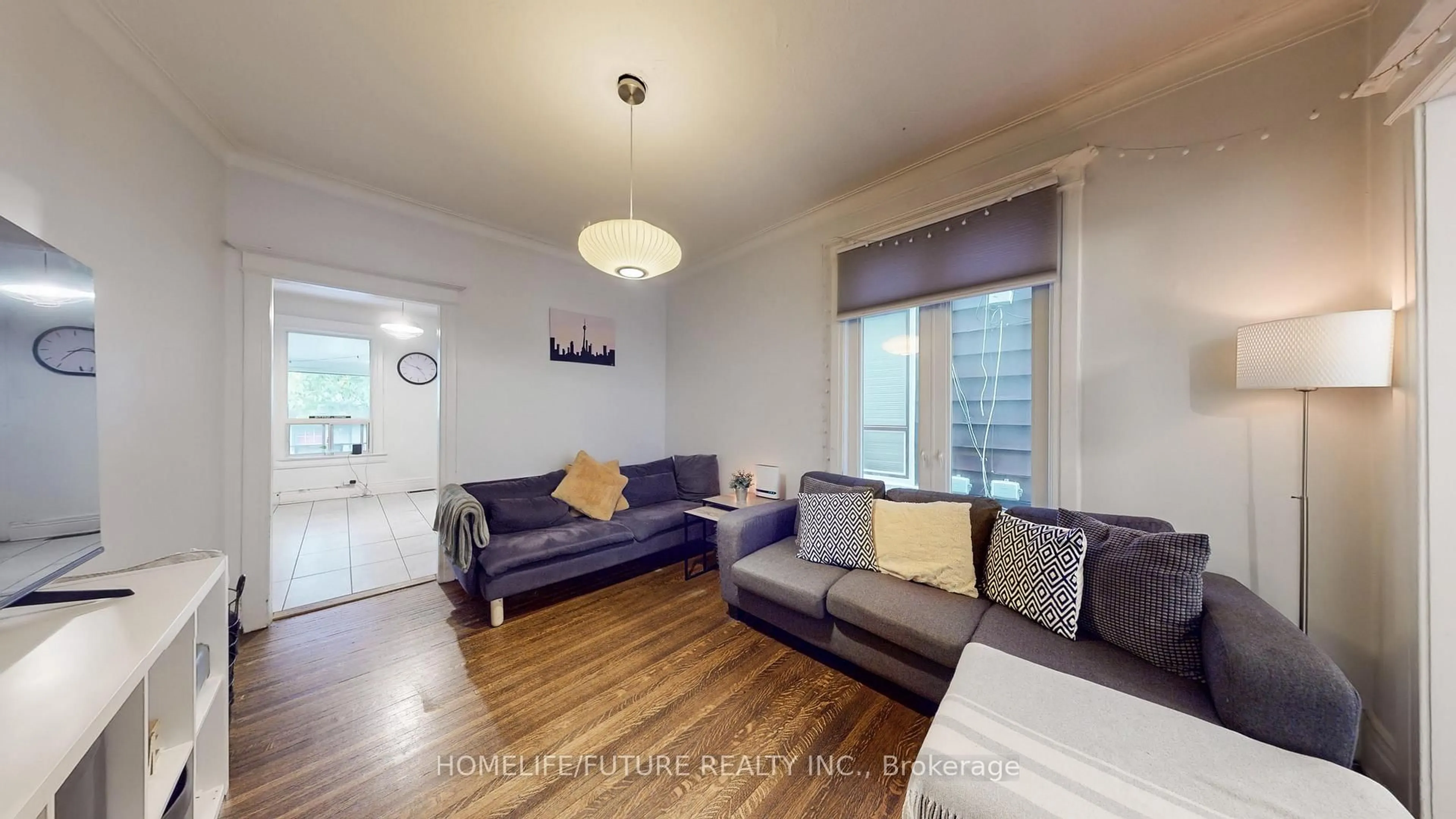 Living room with furniture, wood/laminate floor for 358 Brock Ave, Toronto Ontario M6H 3N3