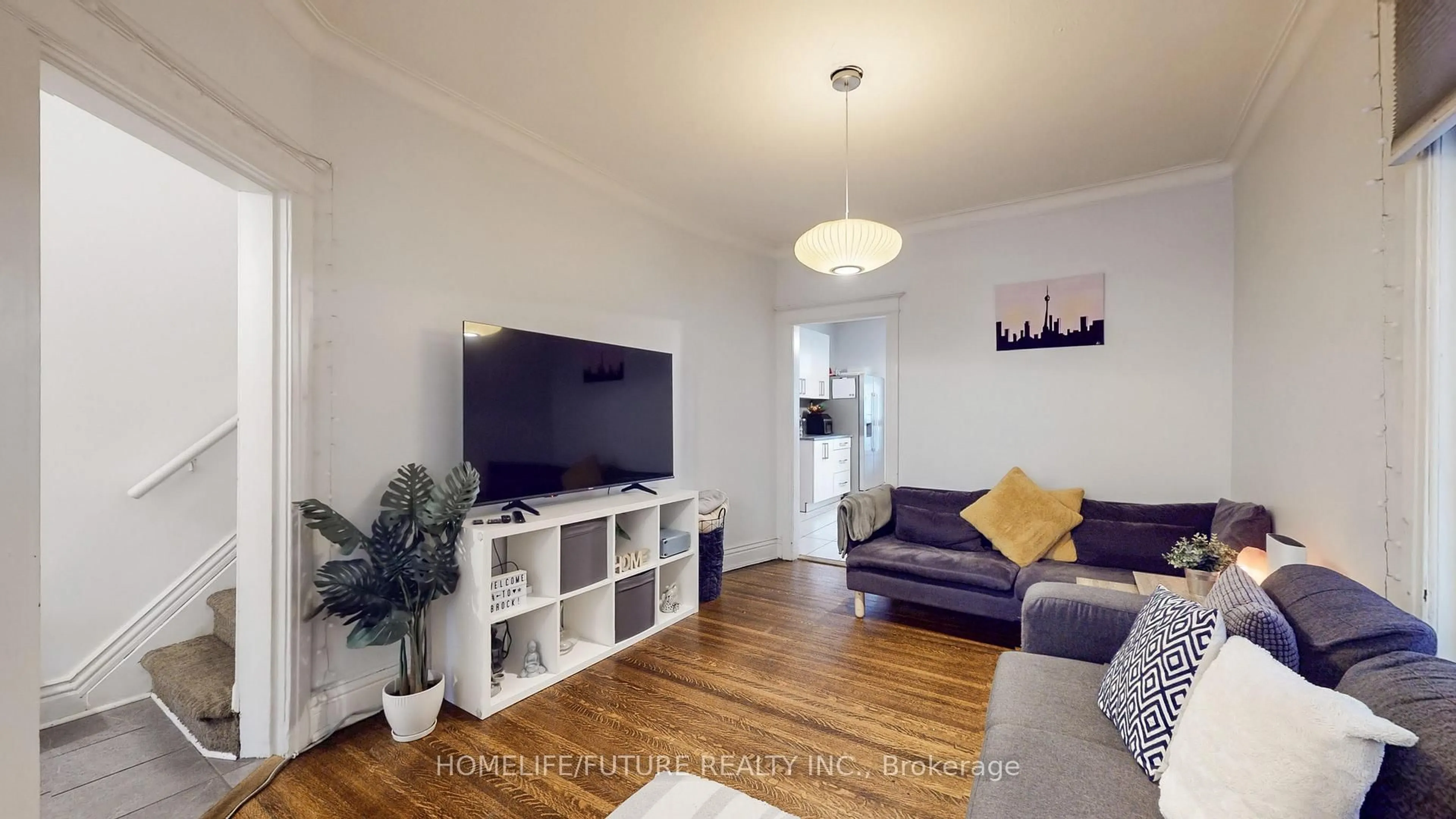 Living room with furniture, wood/laminate floor for 358 Brock Ave, Toronto Ontario M6H 3N3