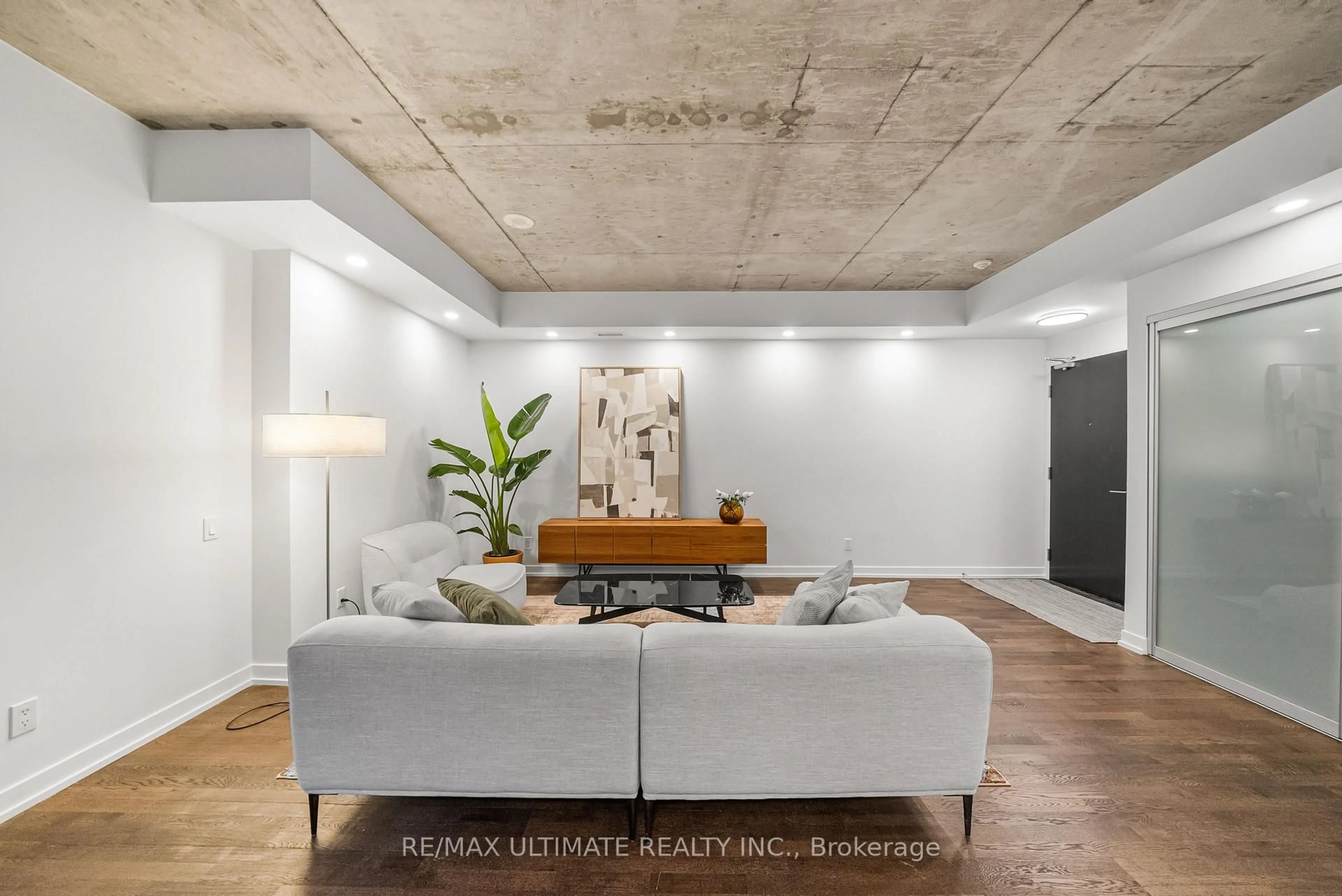 Living room with furniture, cement floor for 650 King St #315, Toronto Ontario M5V 0H6