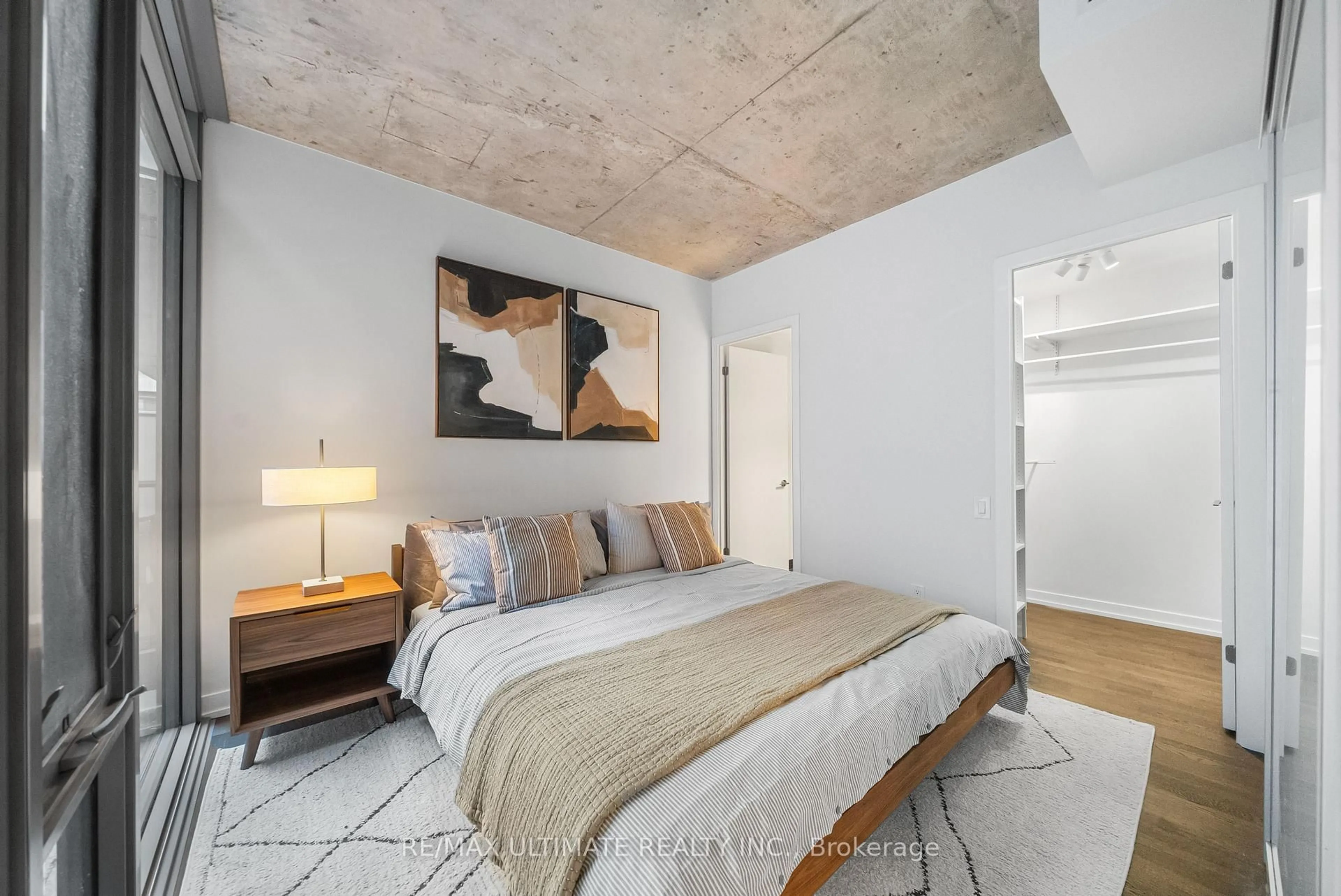 Bedroom with bed, cement floor for 650 King St #315, Toronto Ontario M5V 0H6
