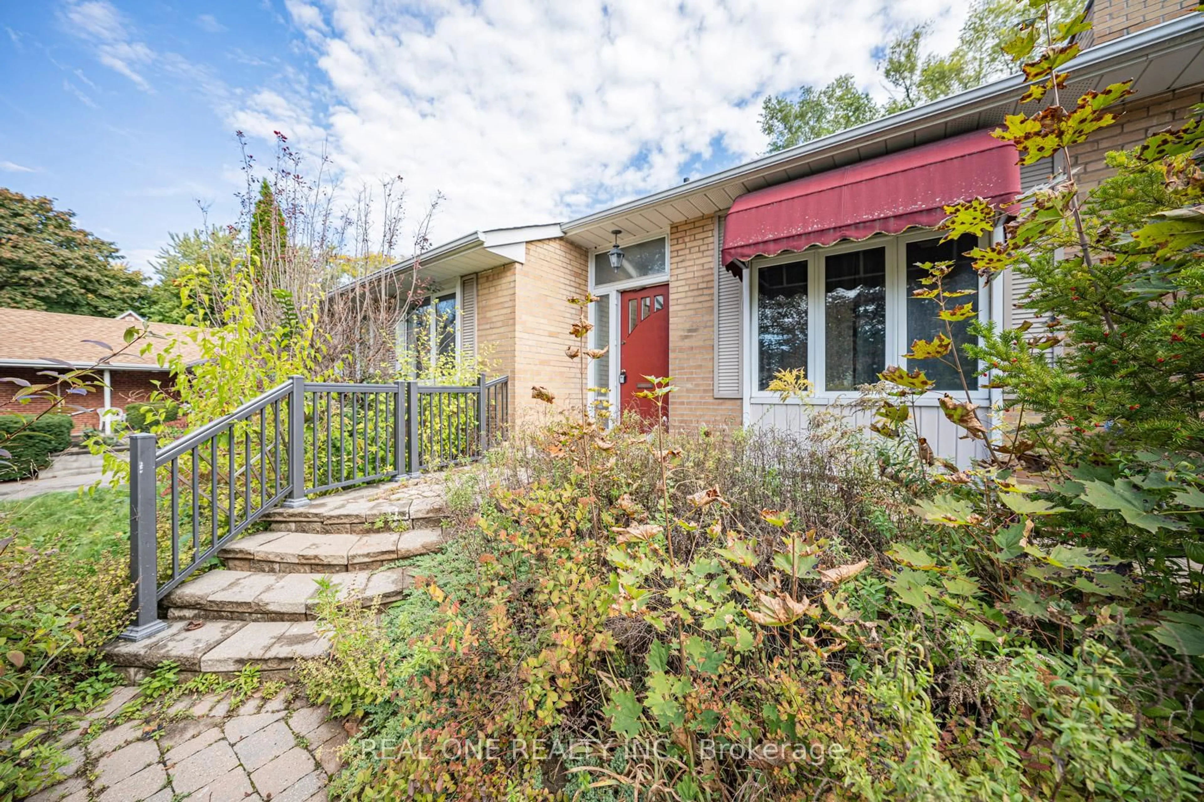 Home with brick exterior material, street for 60 Paperbirch Dr, Toronto Ontario M3C 2E7