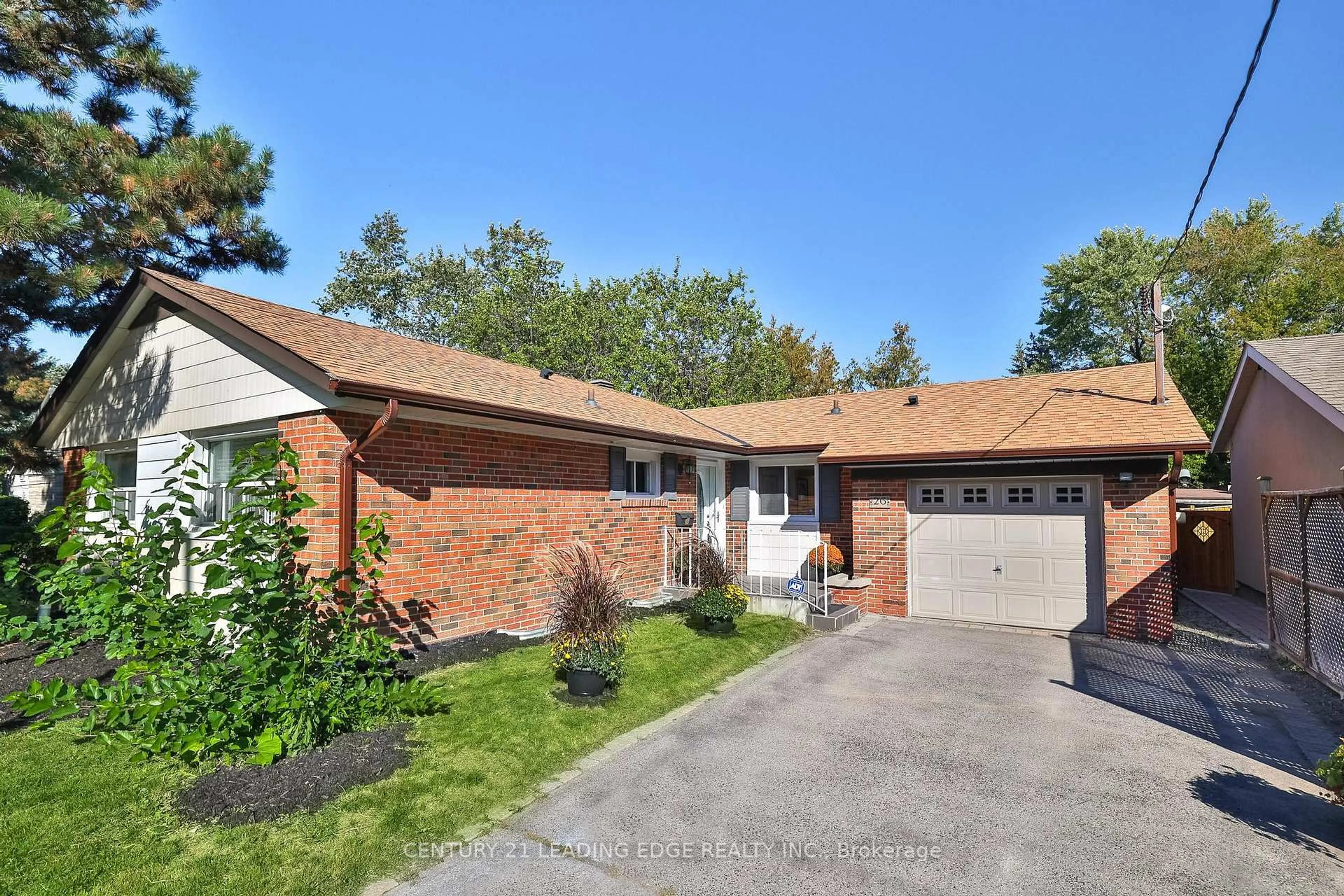 Home with brick exterior material, street for 26 ELVASTON Dr, Toronto Ontario M4A 1M9