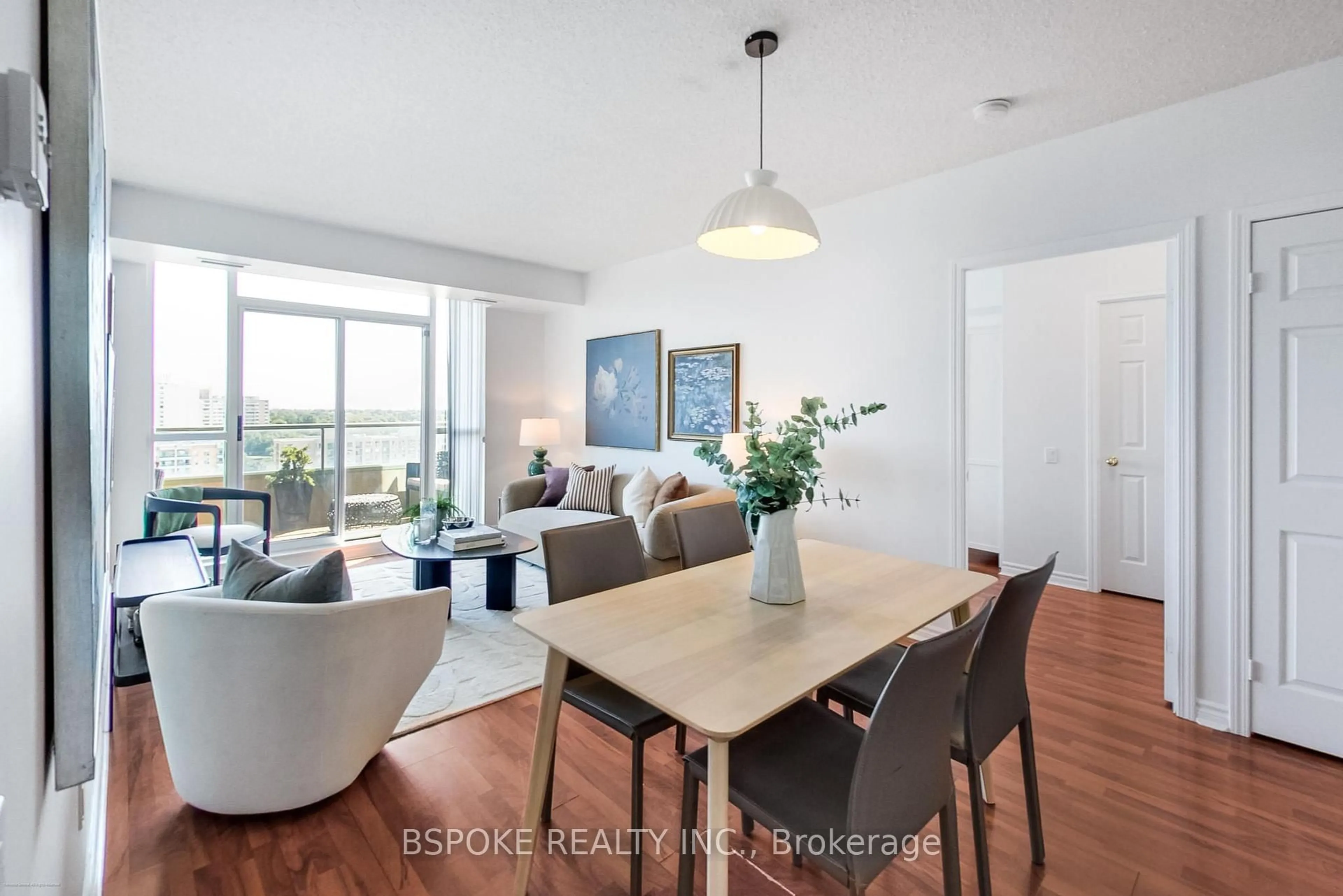 Living room with furniture, wood/laminate floor for 8 Covington Rd #1412, Toronto Ontario M6A 3E5
