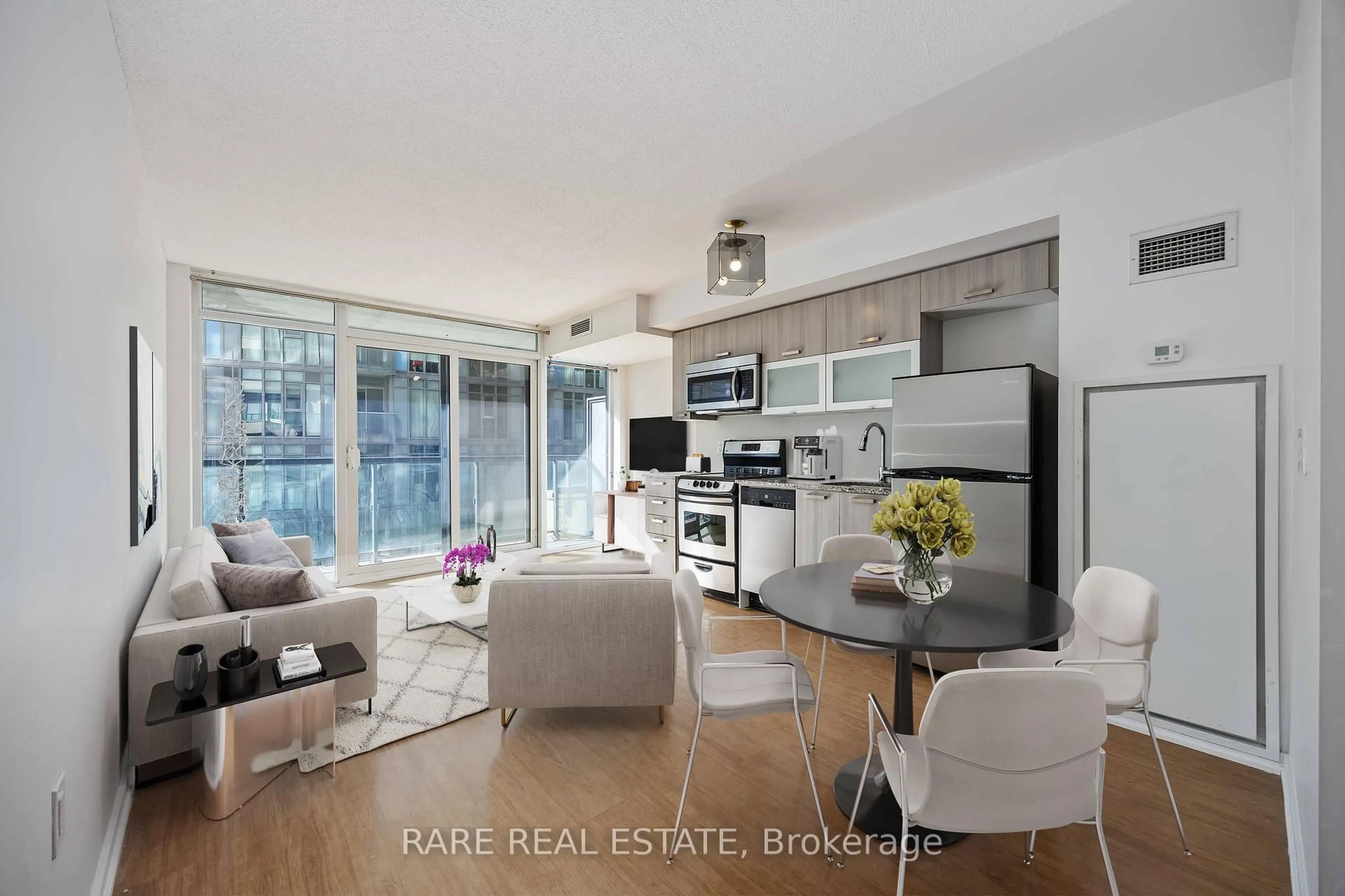 Open concept kitchen, wood/laminate floor for 36 Lisgar St #519W, Toronto Ontario M6J 0C7