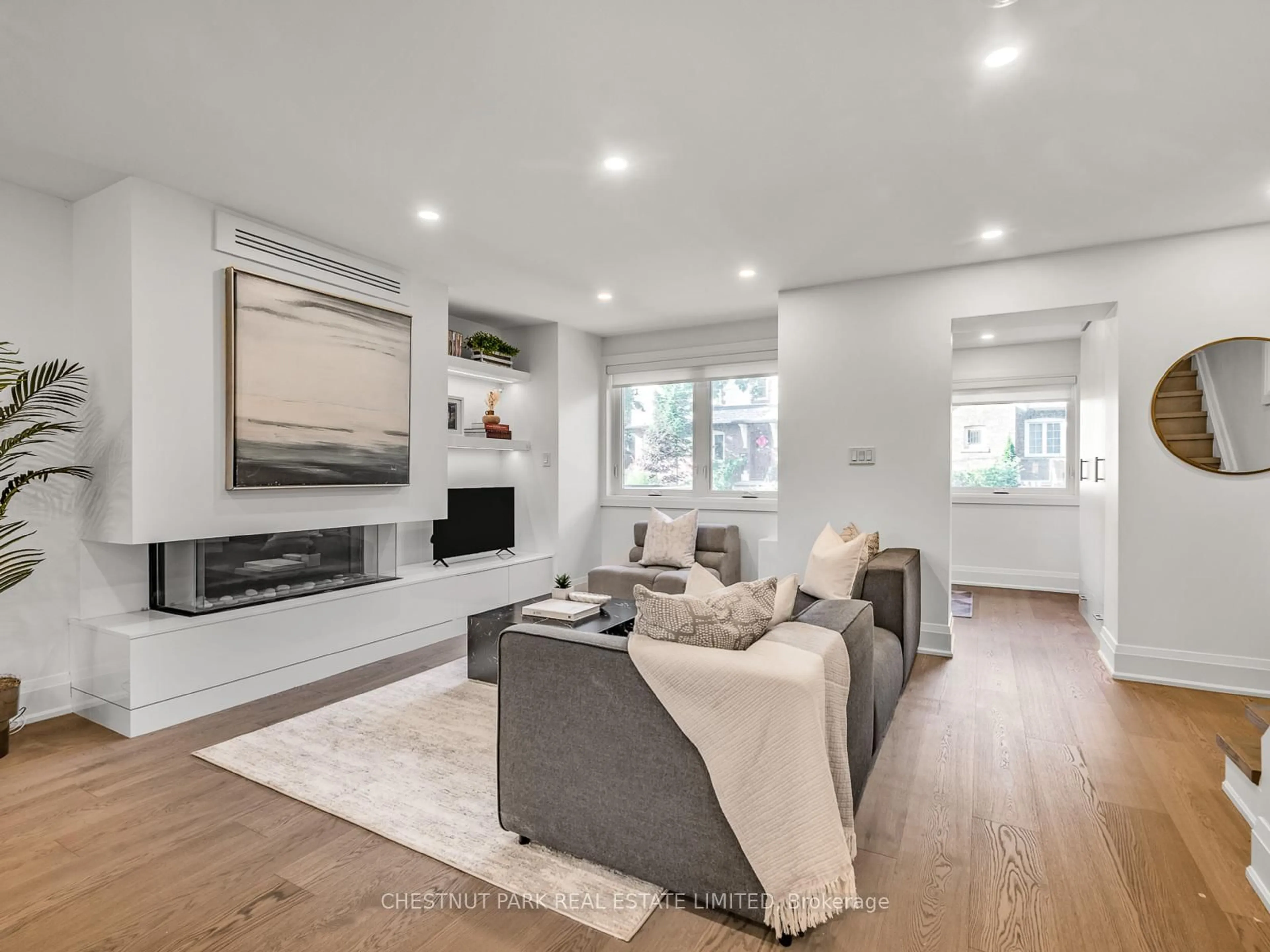 Living room with furniture, wood/laminate floor for 629 Duplex Ave, Toronto Ontario M4R 1W1