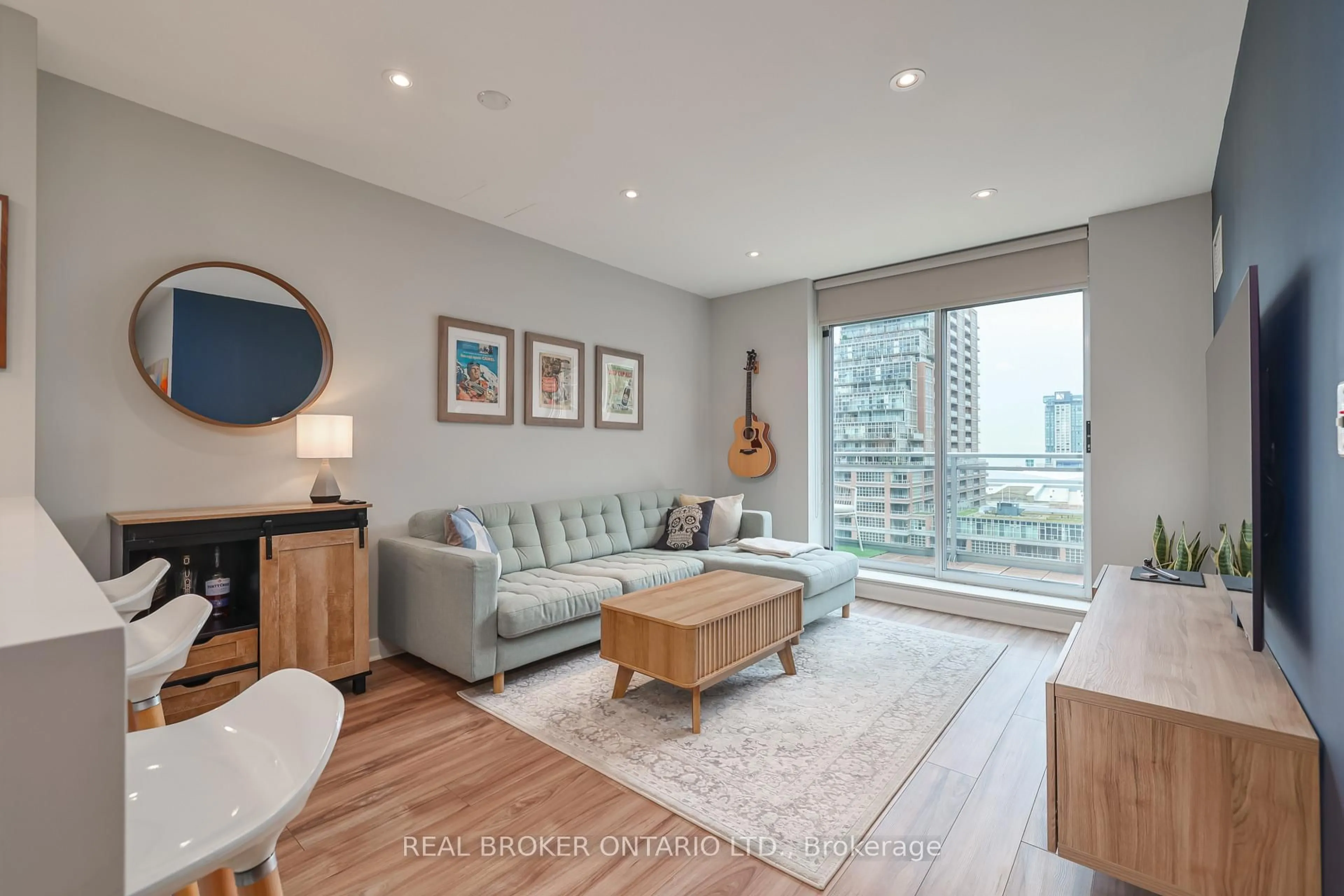Living room with furniture, wood/laminate floor for 50 Lynn Williams St #905, Toronto Ontario M6K 3R9