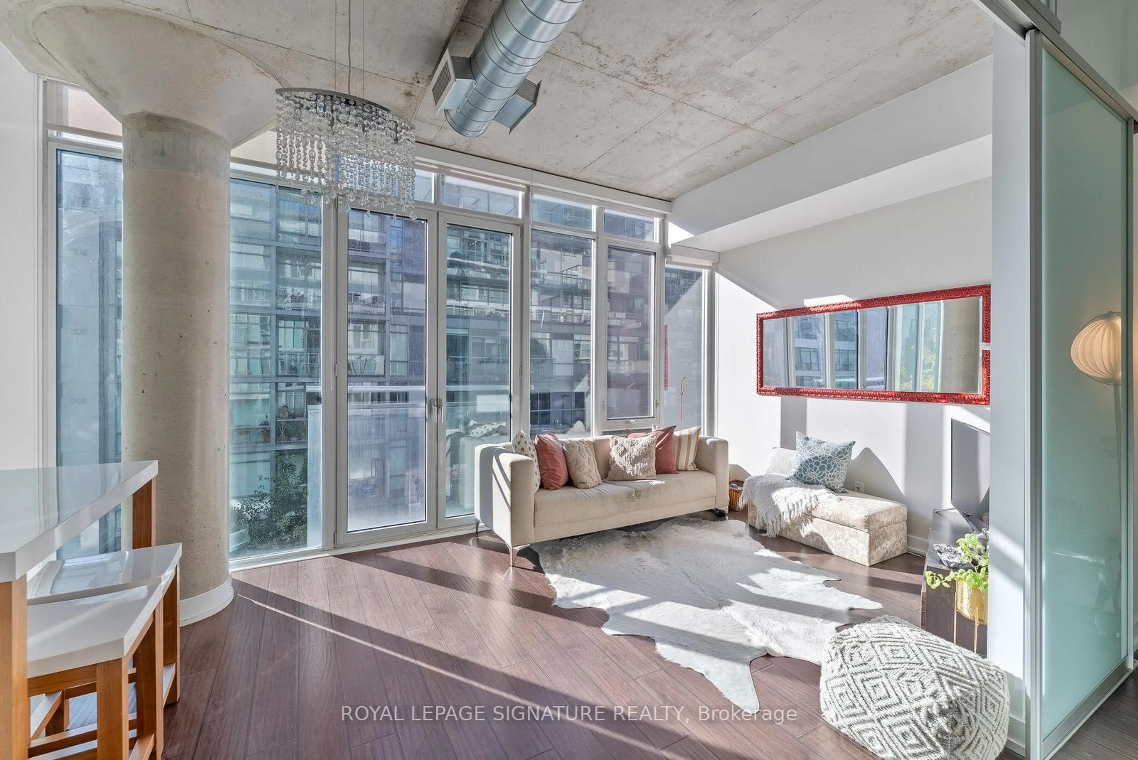 Living room with furniture, cement floor for 20 Stewart St #504, Toronto Ontario M5V 1H6