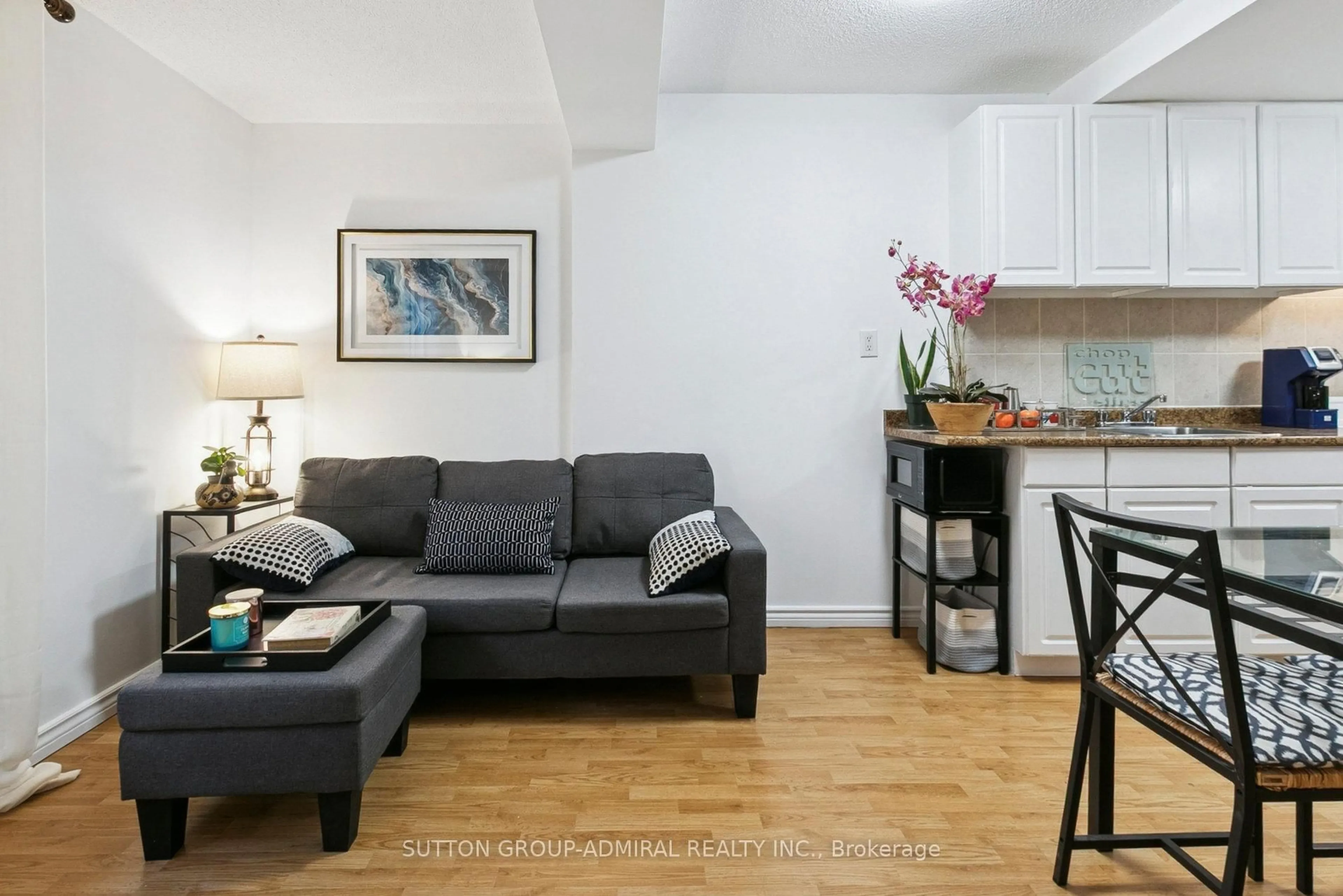 Living room with furniture, wood/laminate floor for 88 Charles St #305, Toronto Ontario M4Y 2W7