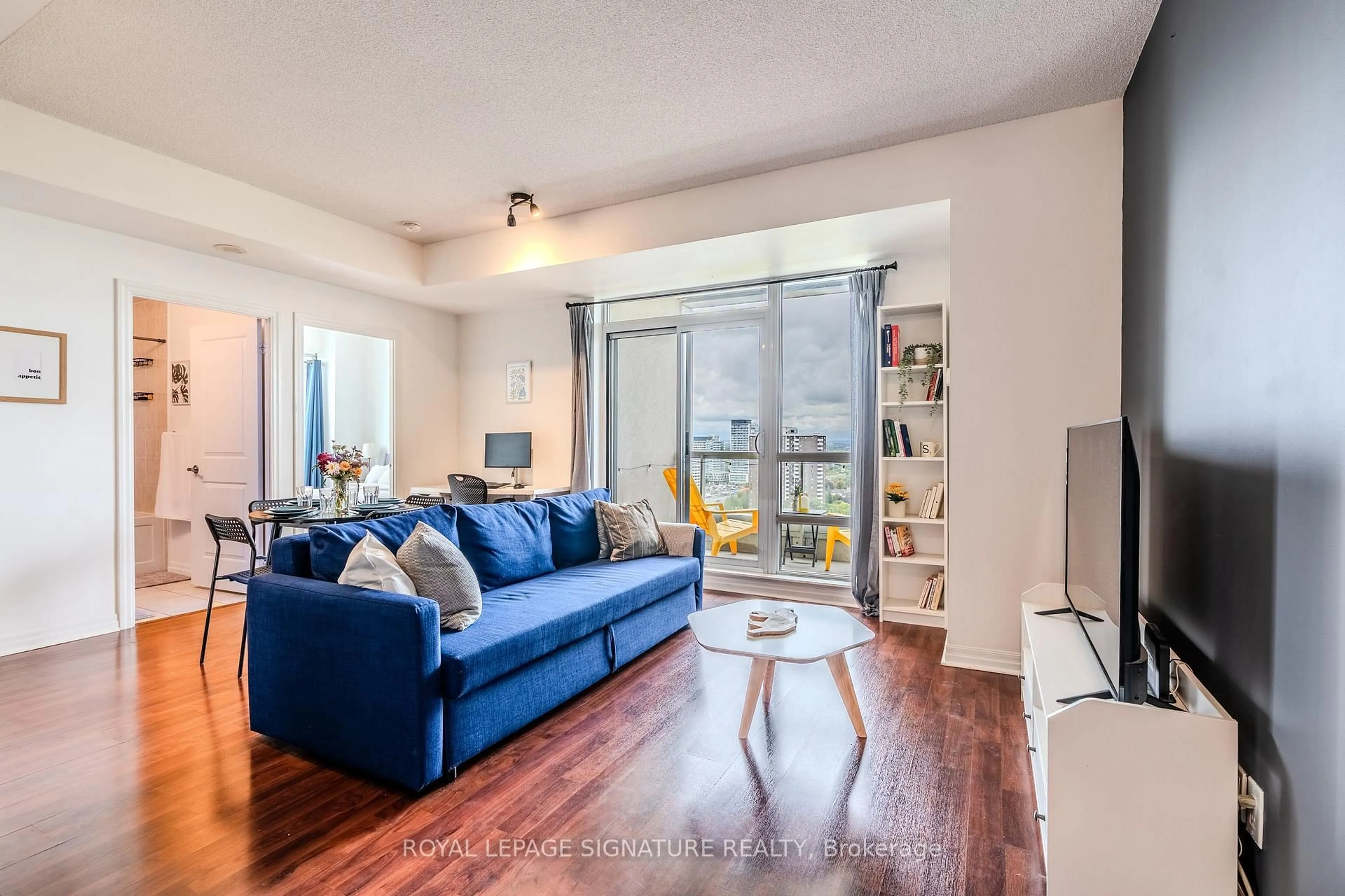 Living room with furniture, wood/laminate floor for 30 Herons Hill Way #1901, Toronto Ontario M2J 0A7