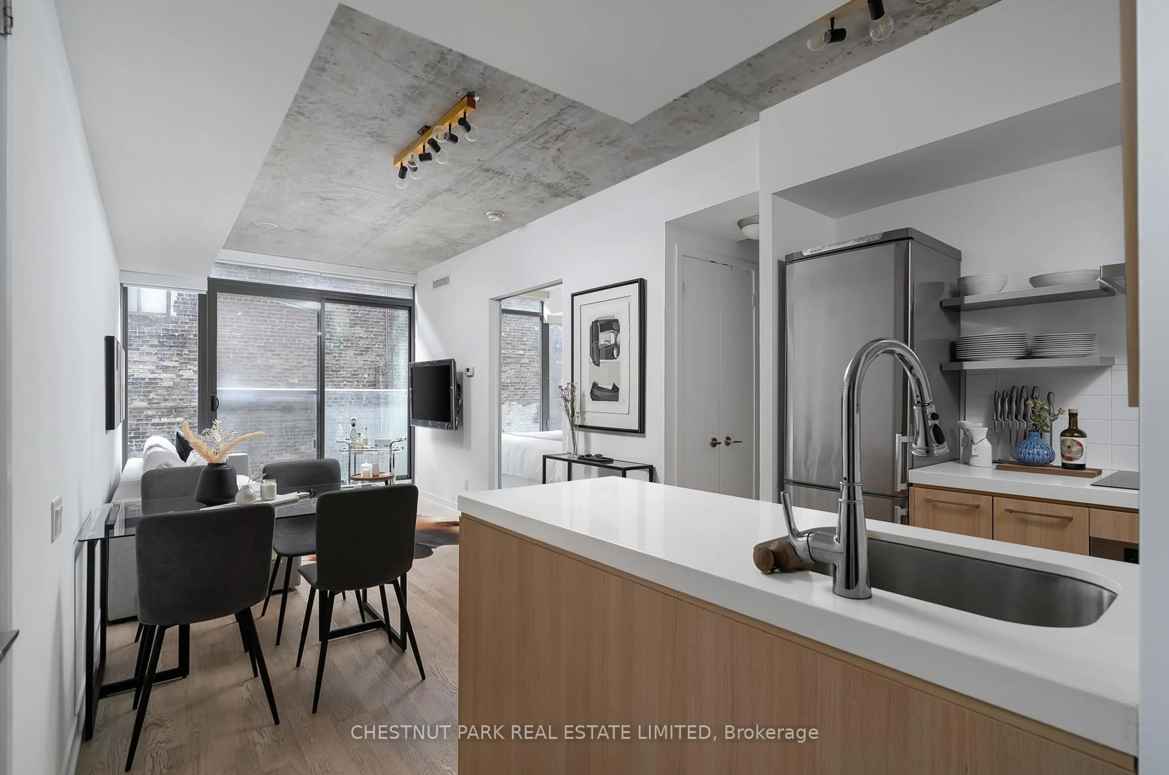Open concept kitchen, cement floor for 461 Adelaide St #230, Toronto Ontario M5V 0L6
