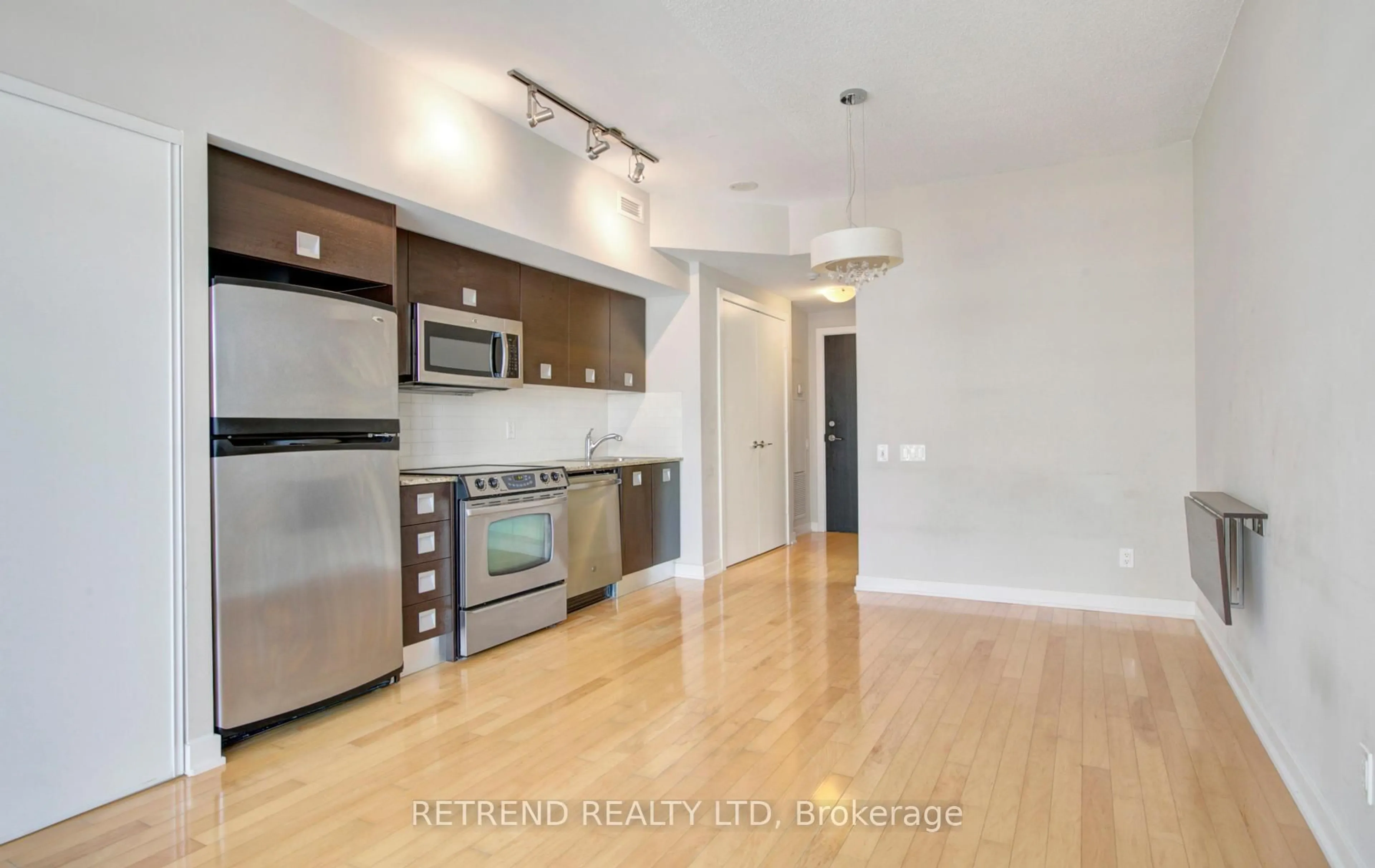 Open concept kitchen, wood/laminate floor for 33 Charles St #1010, Toronto Ontario M4Y 0B7