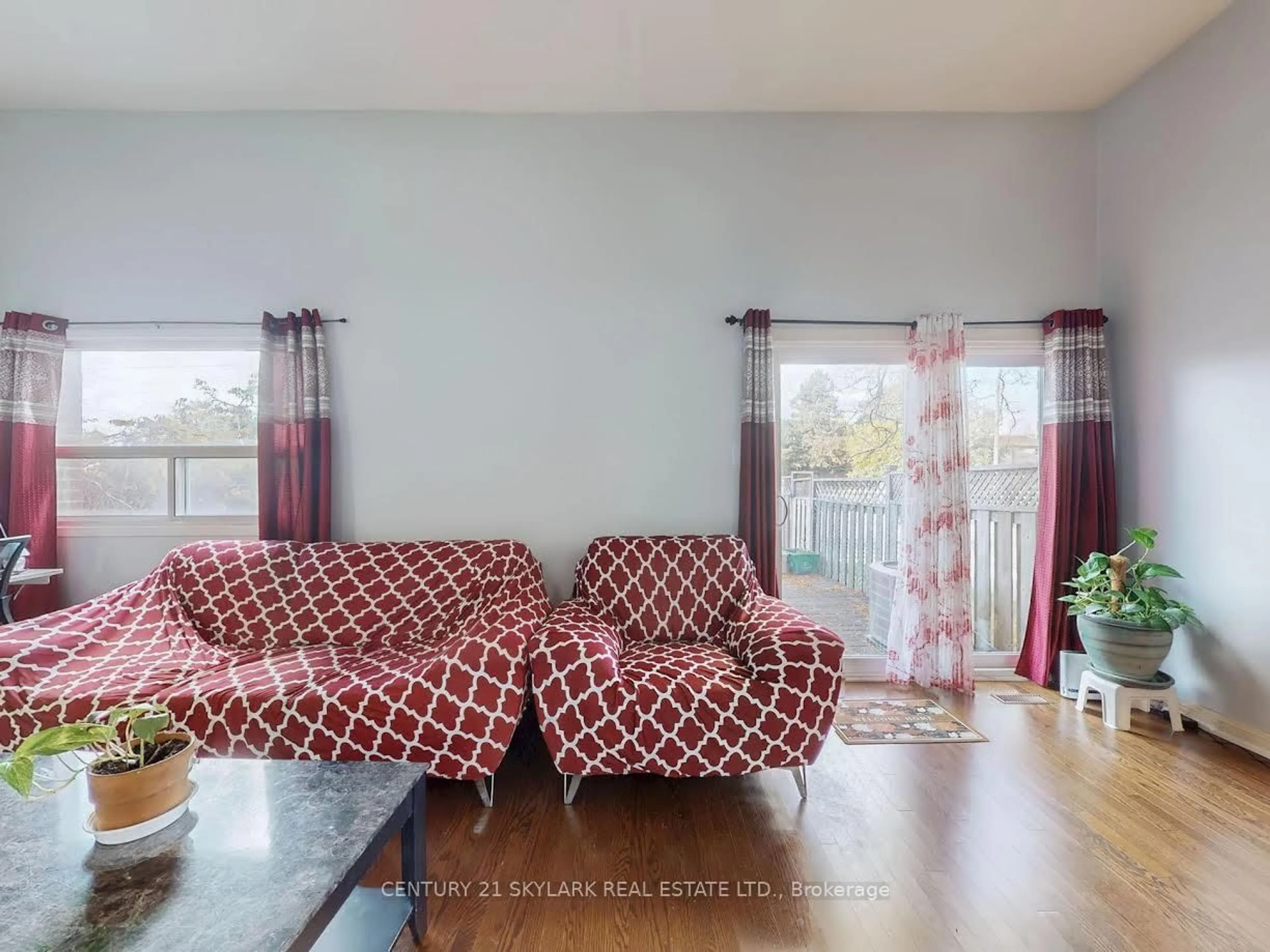 Living room with furniture, wood/laminate floor for 2 Dove Hawk Way, Toronto Ontario M2R 3M2