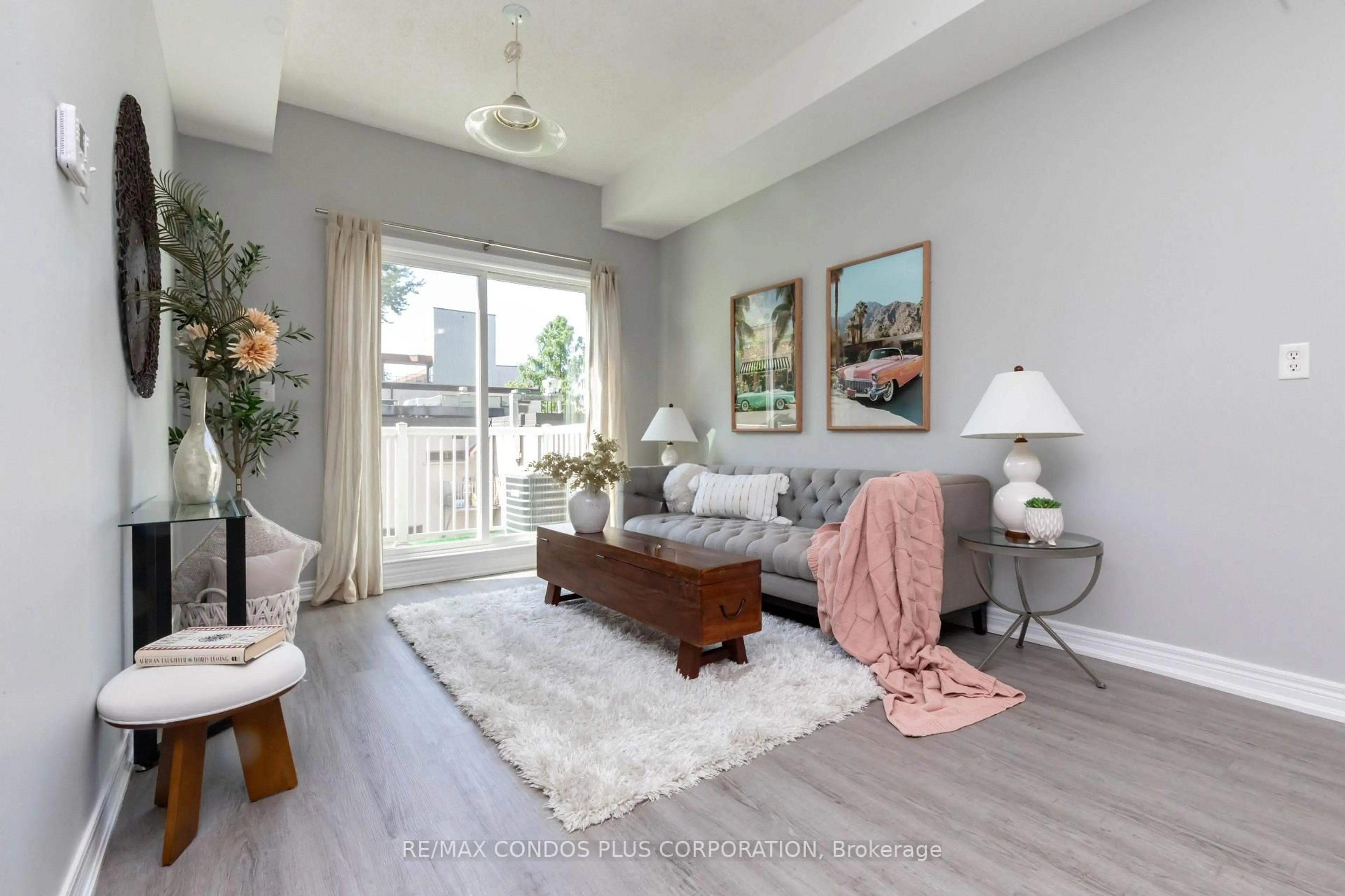 Living room with furniture, wood/laminate floor for 179 Bleecker St #237, Toronto Ontario M4X 1L9