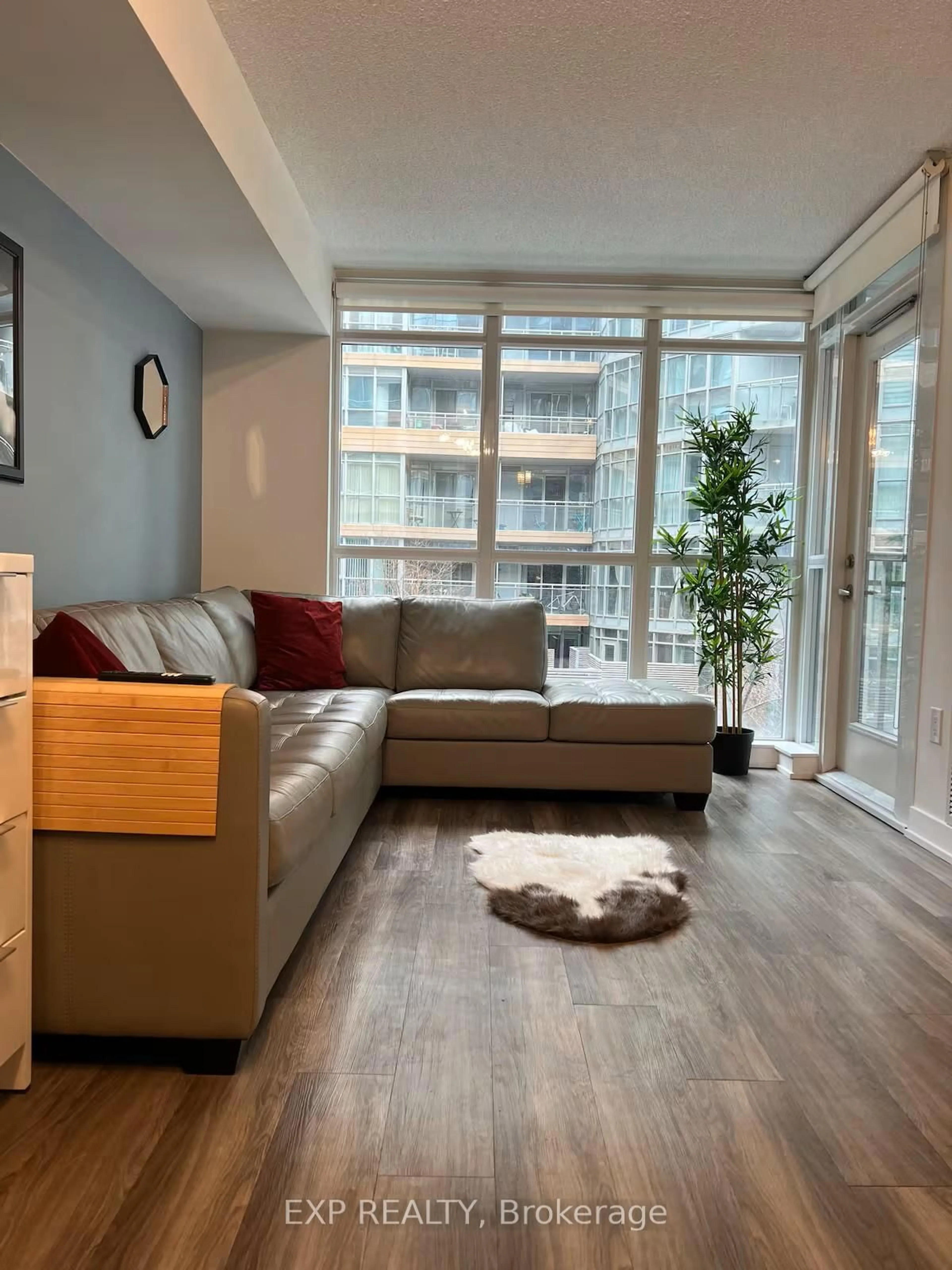 Living room with furniture, wood/laminate floor for 151 Dan Leckie Way #347, Toronto Ontario M5V 4B2