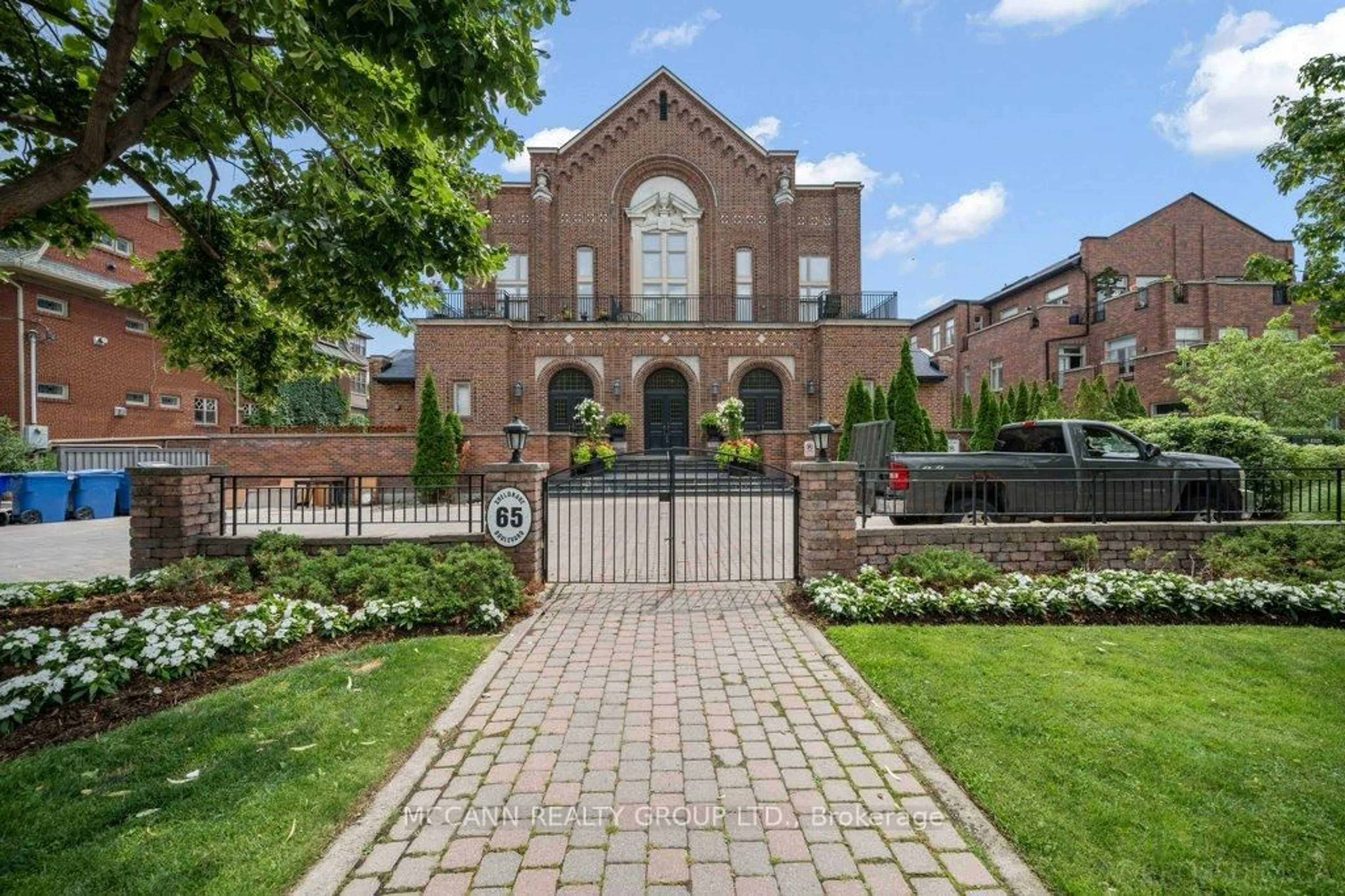 Home with brick exterior material, street for 65 Sheldrake Blvd #208, Toronto Ontario M4P 2B1