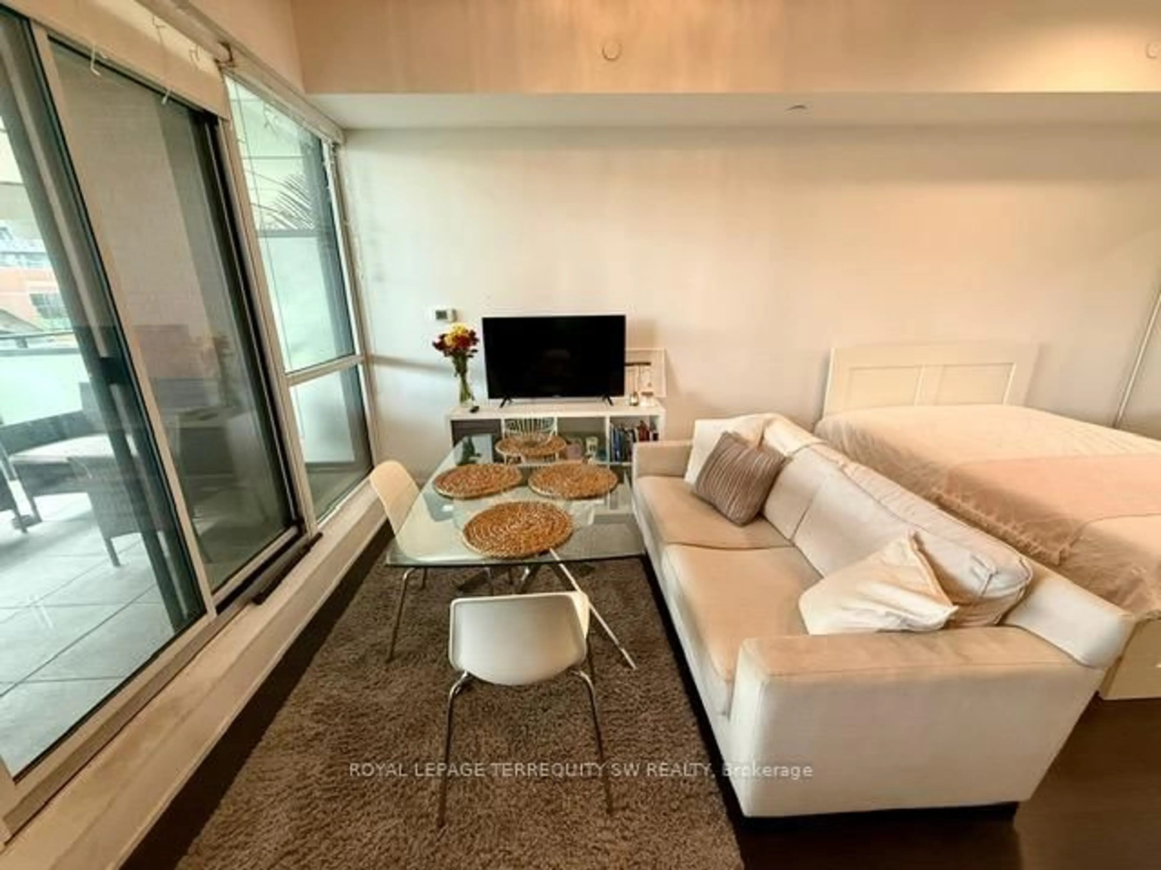 Living room with furniture, unknown for 50 Bruyeres Mews #208, Toronto Ontario M5V 0H8