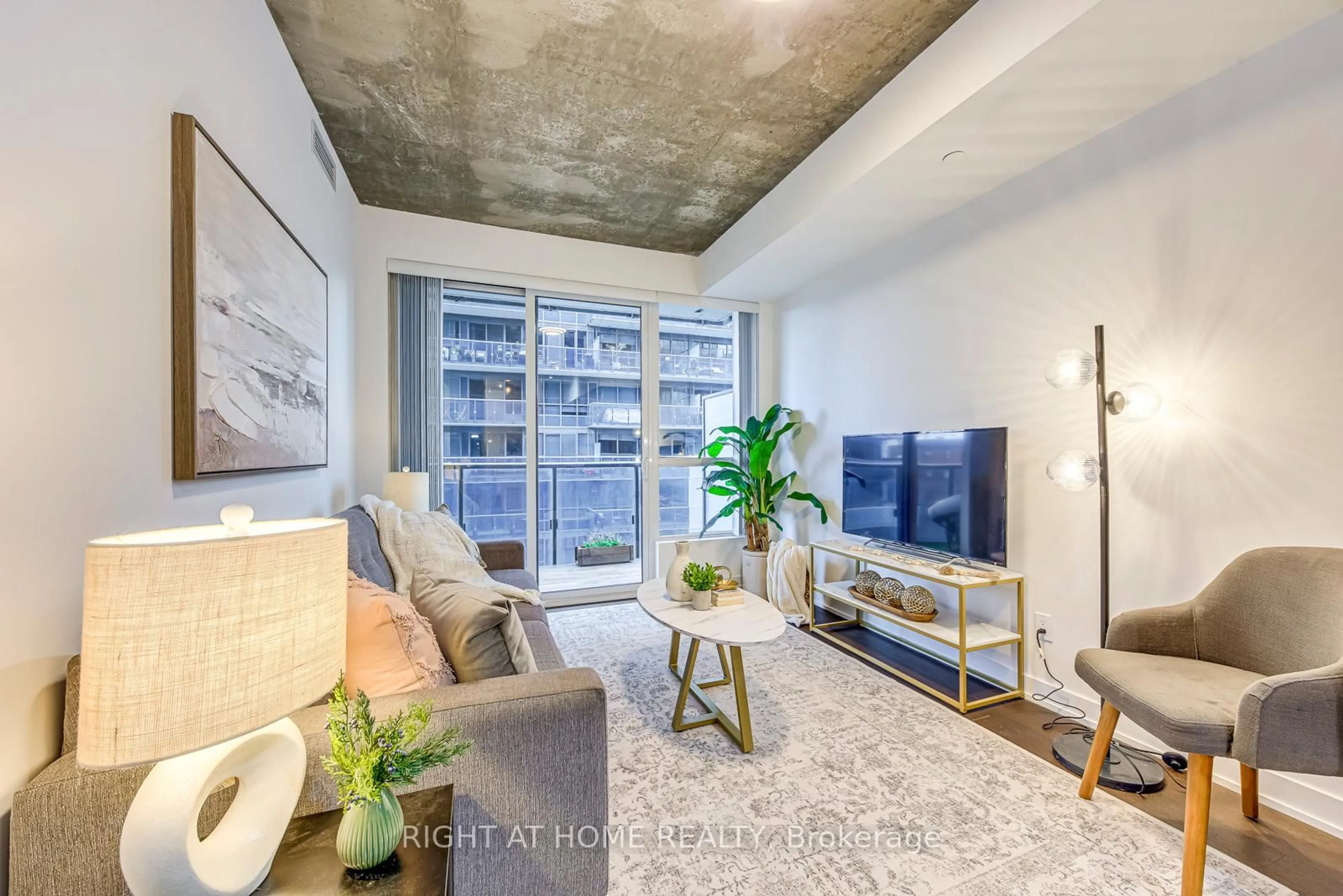 Living room with furniture, cement floor for 1030 King St #748, Toronto Ontario M6K 0B4