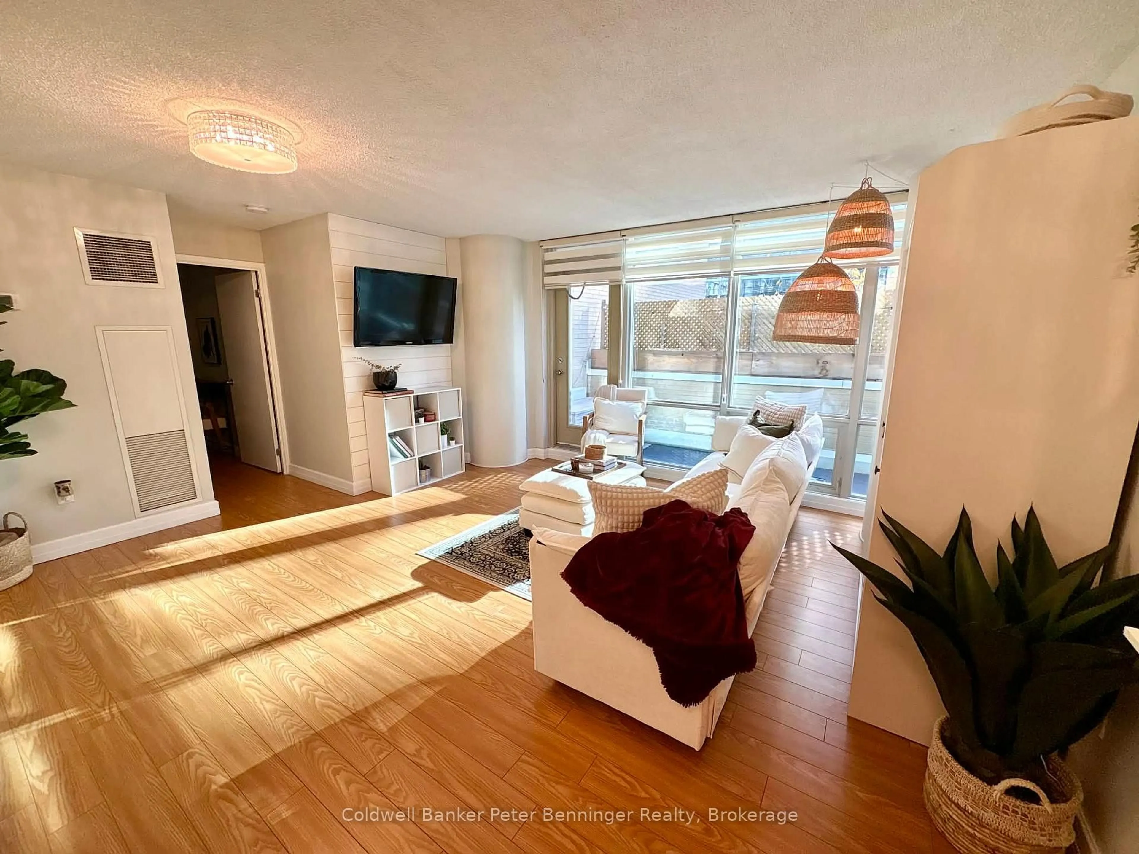 Living room with furniture, wood/laminate floor for 10 Navy Wharf Crt #203, Toronto Ontario M5V 3V2
