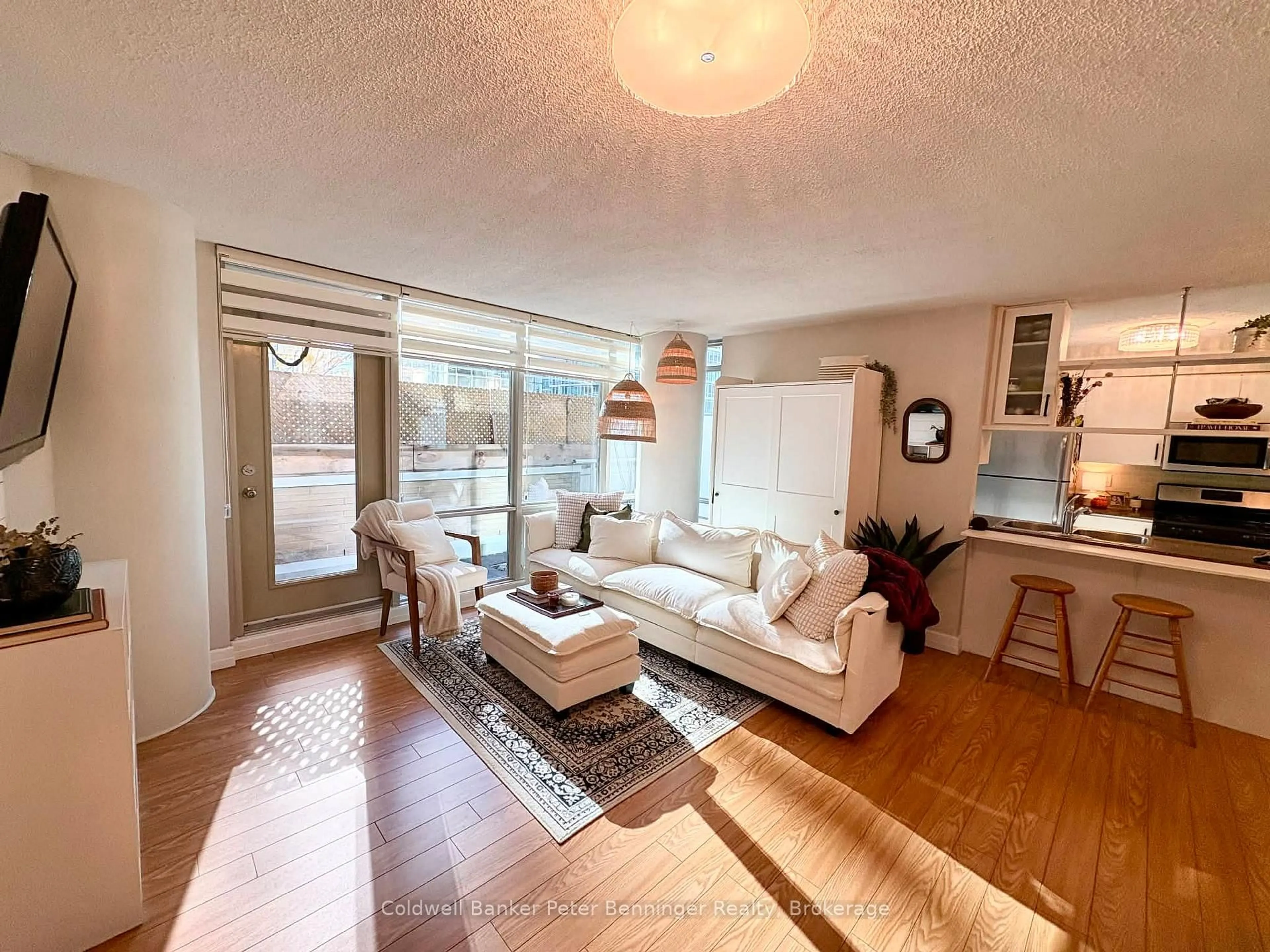 Living room with furniture, wood/laminate floor for 10 Navy Wharf Crt #203, Toronto Ontario M5V 3V2