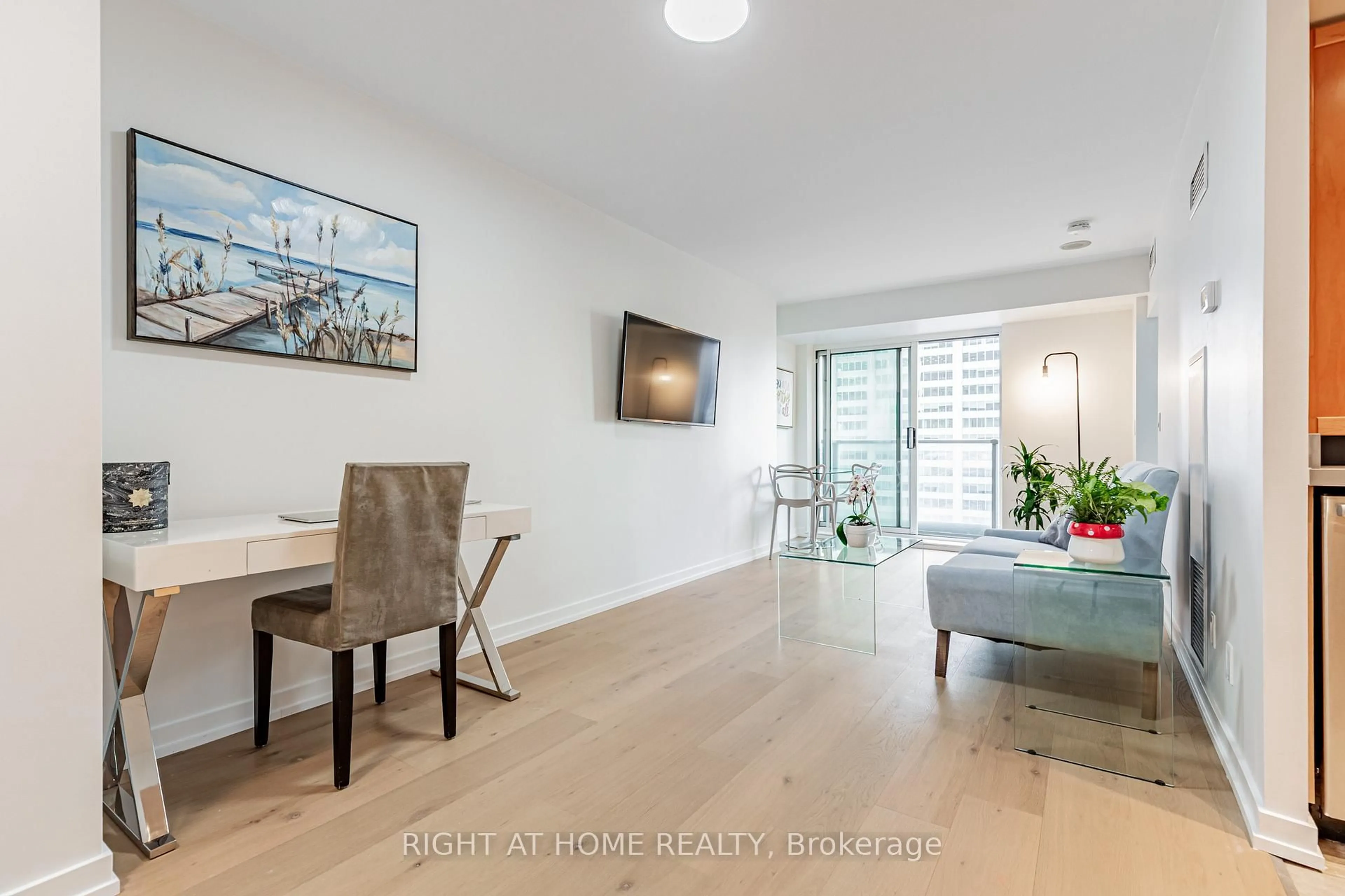 Living room with furniture, wood/laminate floor for 8 Park Rd #3116, Toronto Ontario M4W 3S5