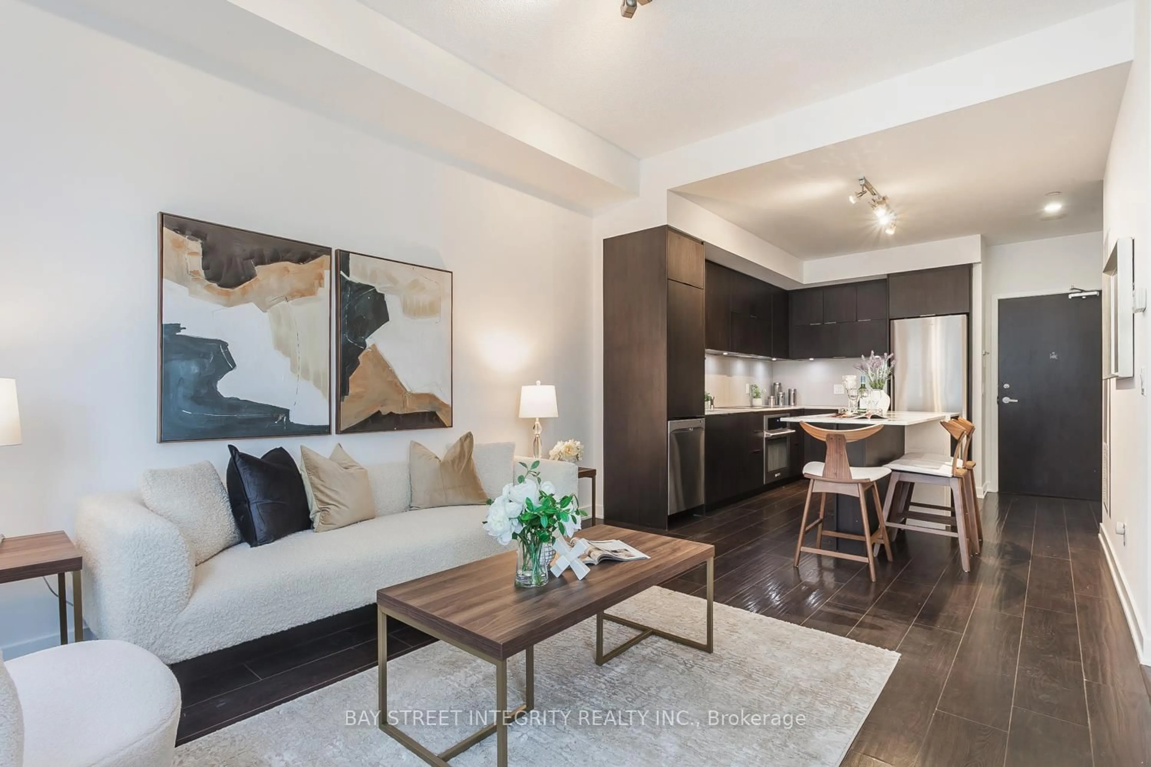 Living room with furniture, wood/laminate floor for 55 Regent Park Blvd #107, Toronto Ontario M5A 0C2