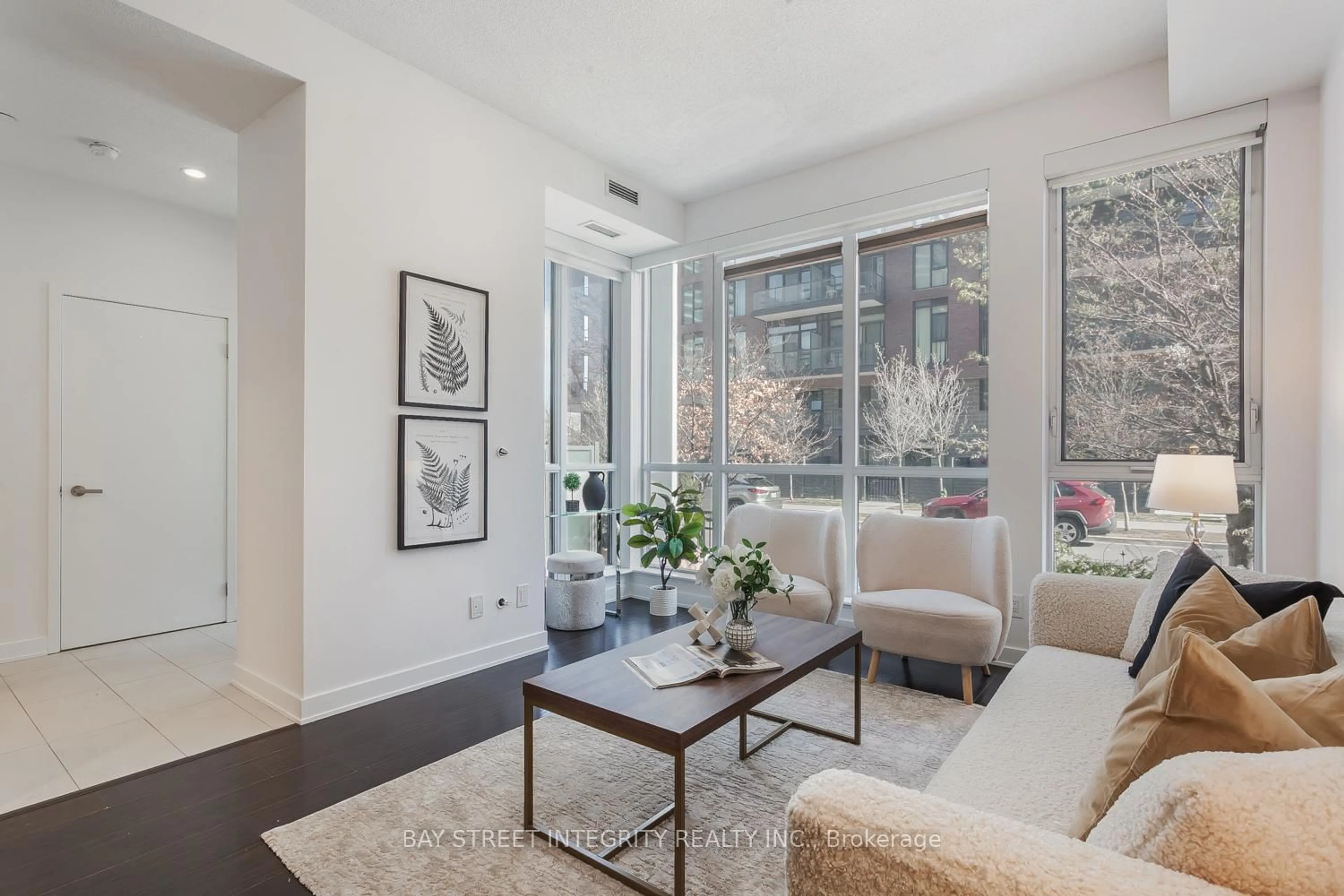 Living room with furniture, unknown for 55 Regent Park Blvd #107, Toronto Ontario M5A 0C2