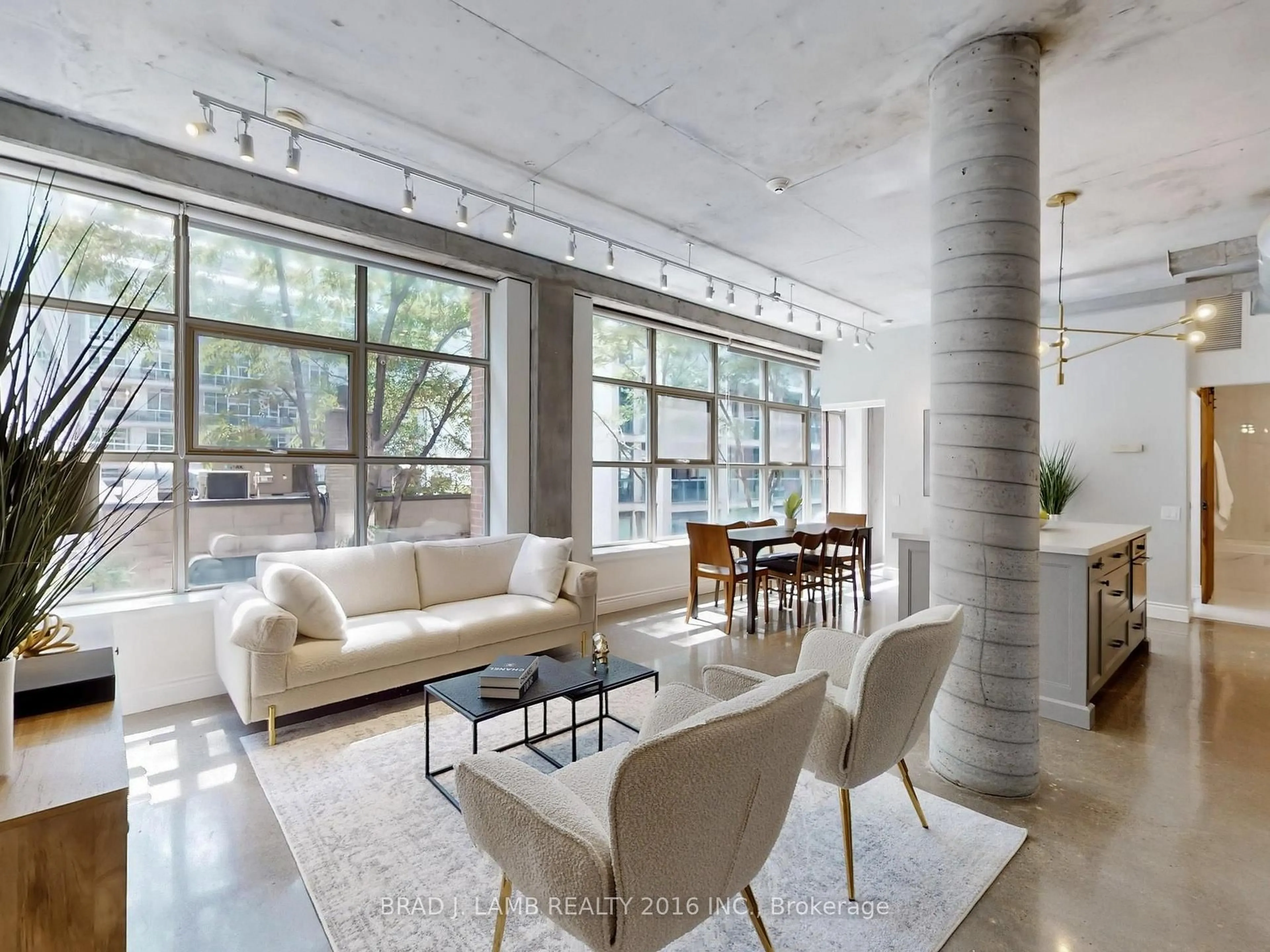 Living room with furniture, cement floor for 29 Camden St #305, Toronto Ontario M5V 3N3